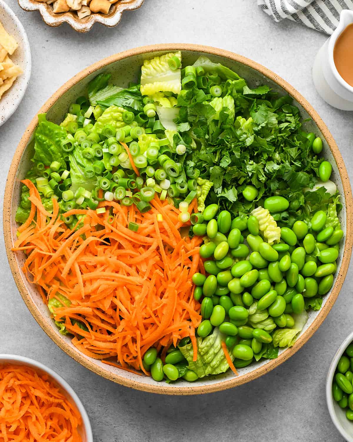 assembling Asian Chicken Salad in a large bowl