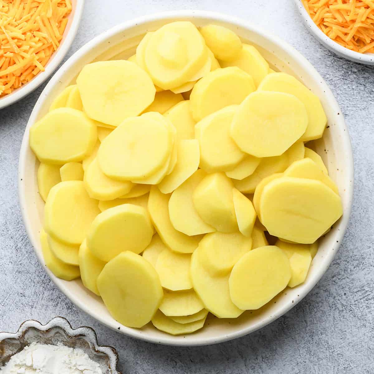 potatoes cut into thin round circles to make Potatoes Au Gratin