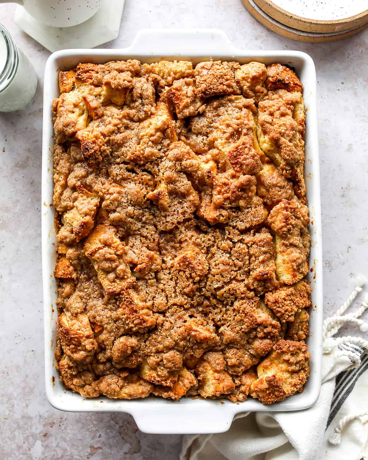 The best Baked French Toast Casserole recipe is an easy & delicious breakfast. French bread is combined with a sweet vanilla egg & milk mixture and topped with a buttery streusel topping. This overnight French toast casserole is made at night and baked in the morning so it's easy to prepare and enjoy! Overnight French Toast Casserole in a baking dish