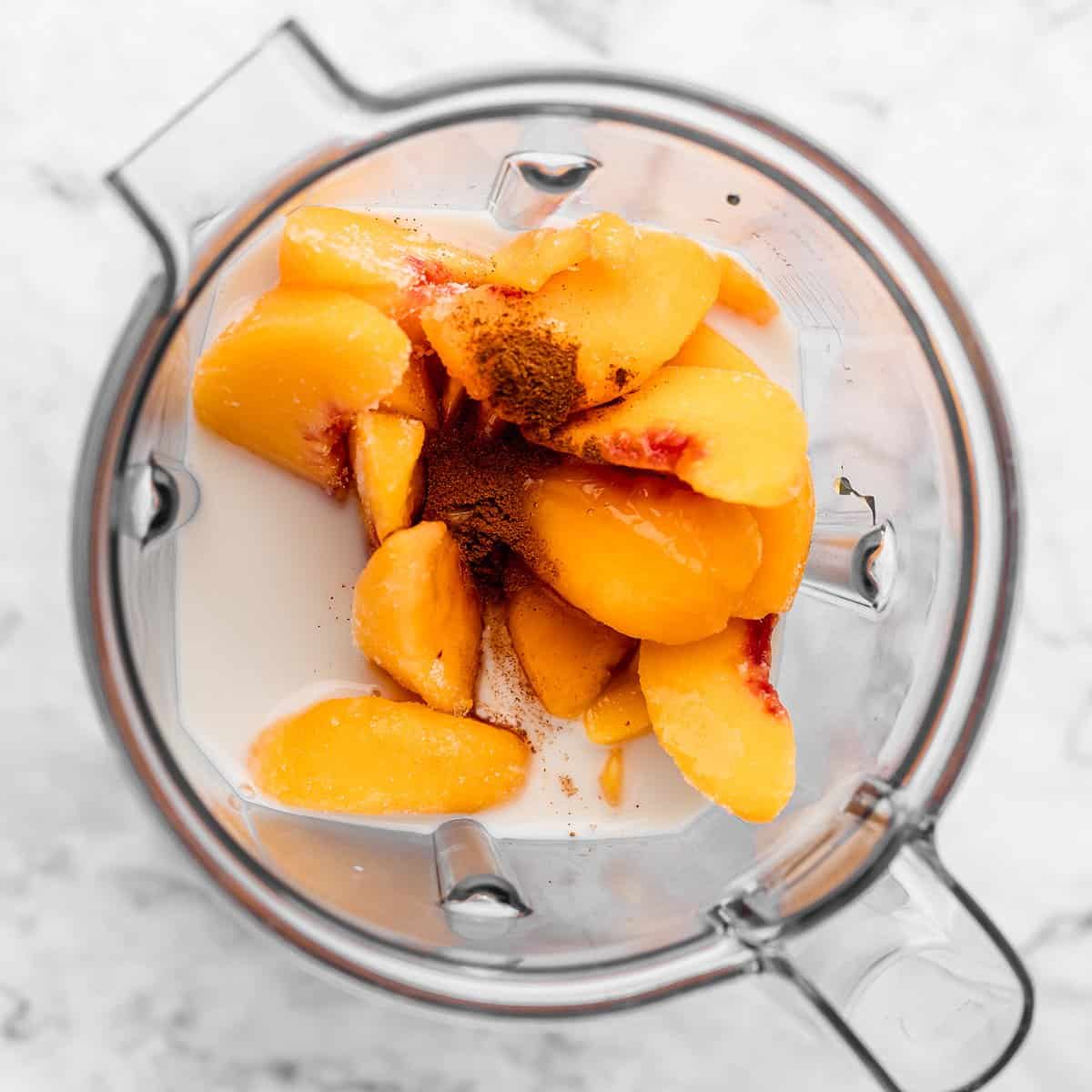 the ingredients in this Peach Smoothie Recipe in a blending container before blending