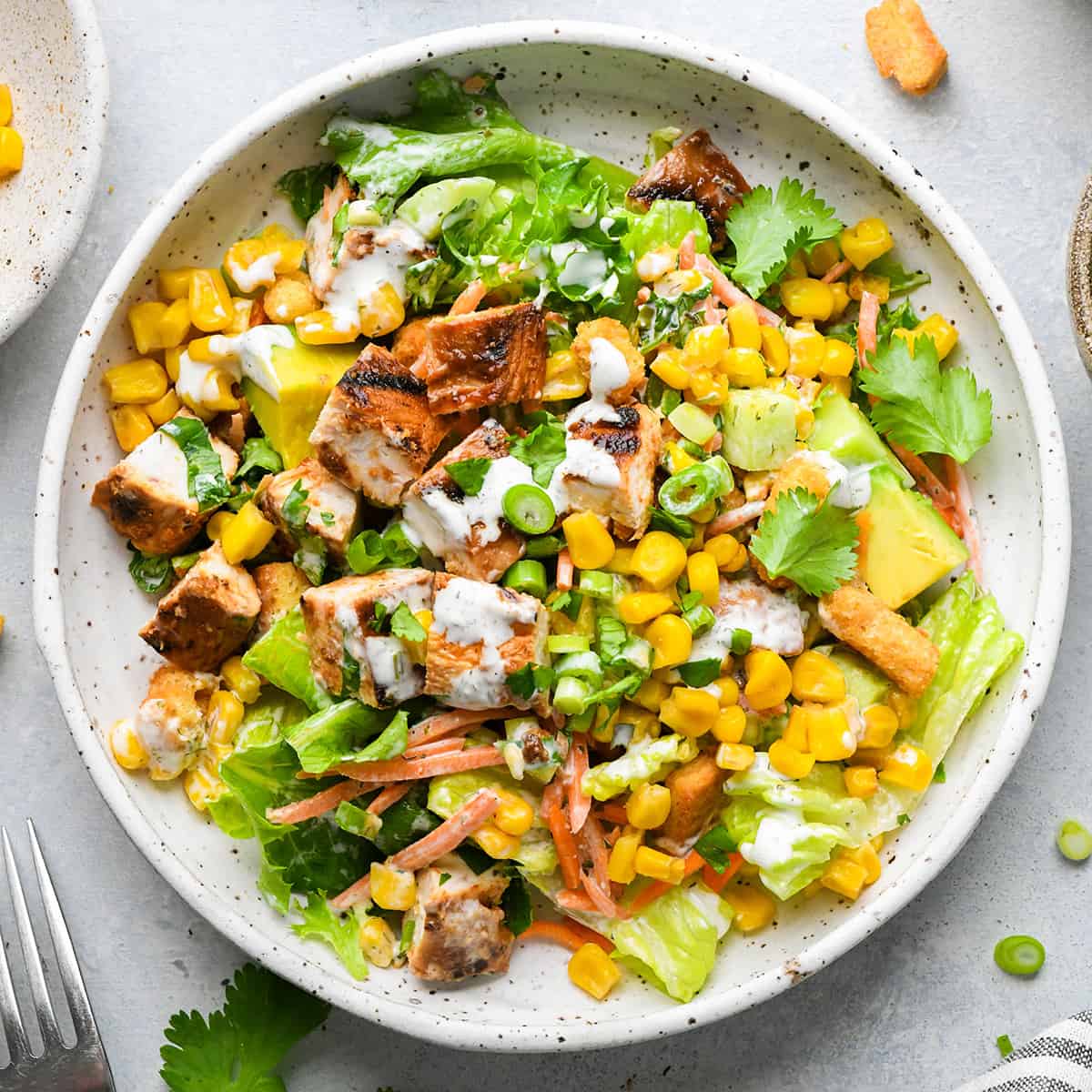 a plate of bbq chicken salad