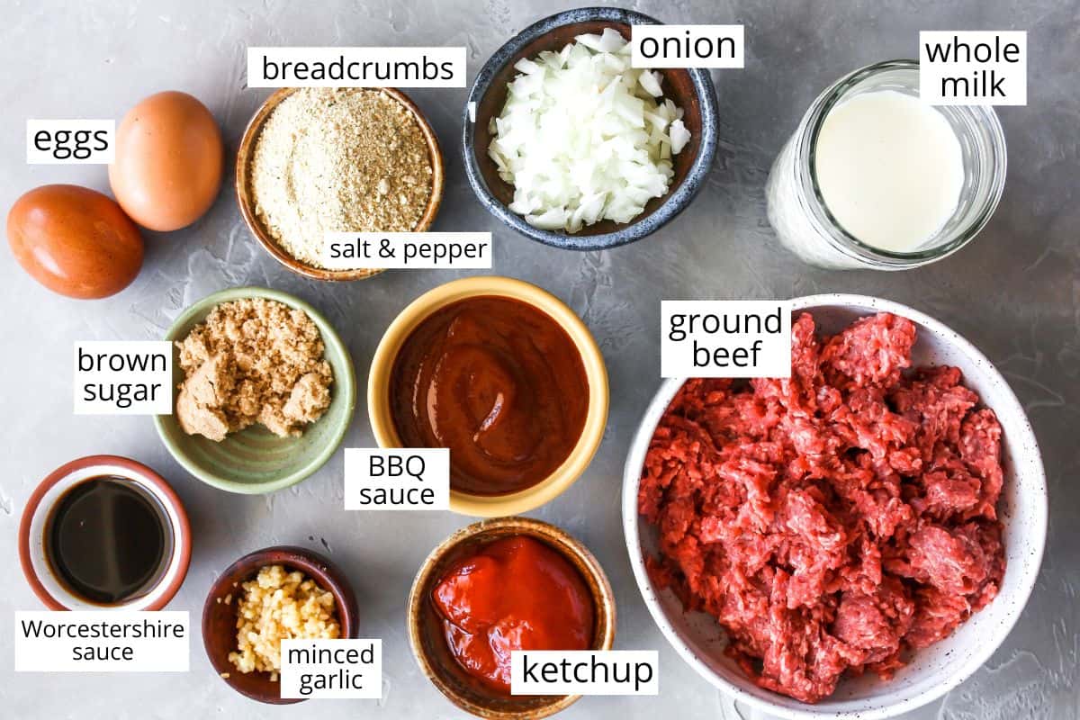 This is the best meatloaf recipe ever! It’s tender, moist and flavorful with the most delicious glaze. This easy meatloaf recipe is a classic that your whole family will love! Watch the video and follow our step-by-step instructions to learn how to make meatloaf! overhead photo of the labeled ingredients in this best meatloaf recipe