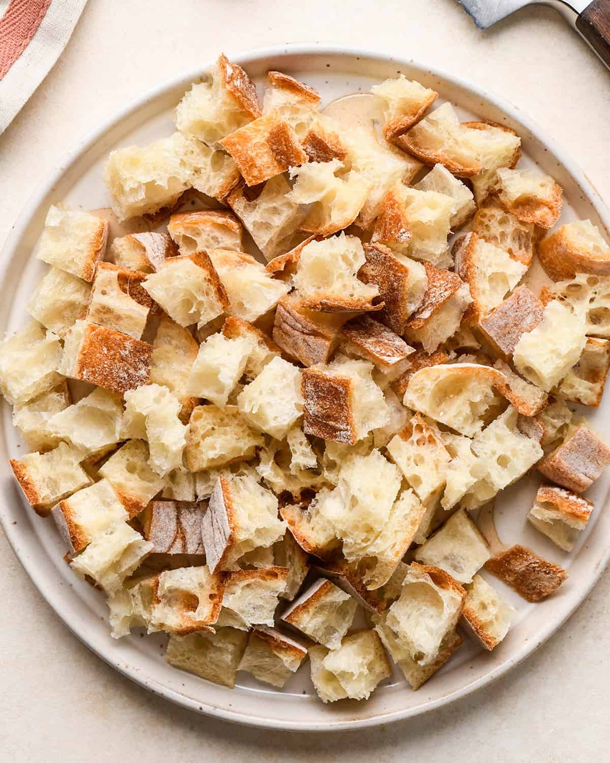 french bread cut into squares on a plate