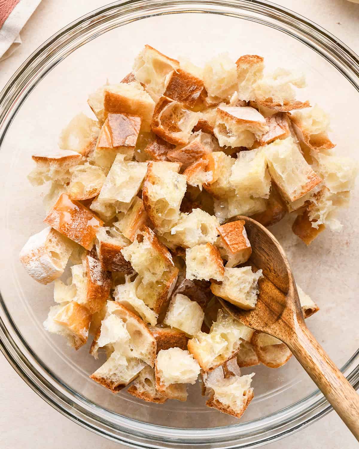How to Make Burrata Salad - making croutons in a glass bowl