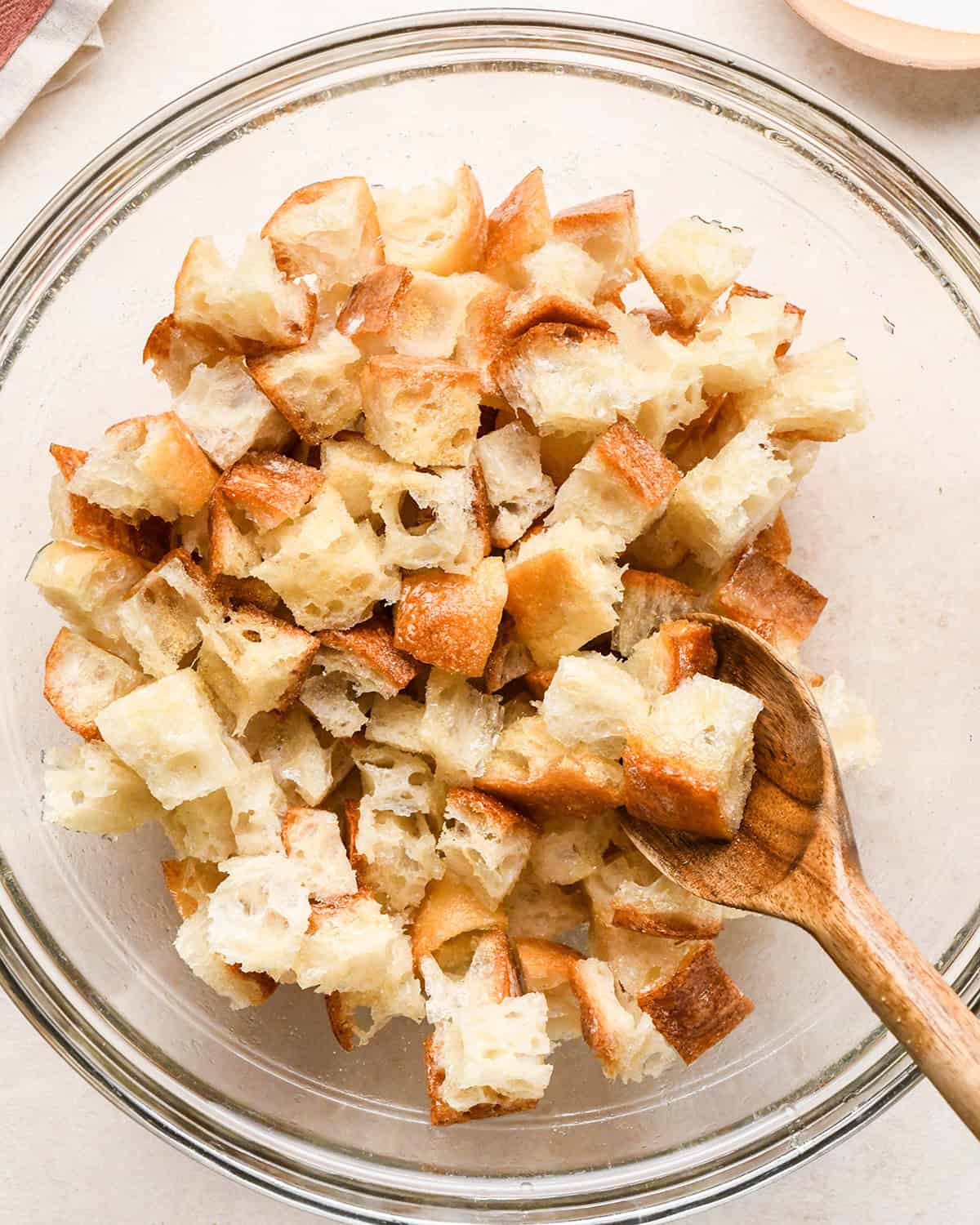 How to Make Burrata Salad - making croutons in a glass bowl