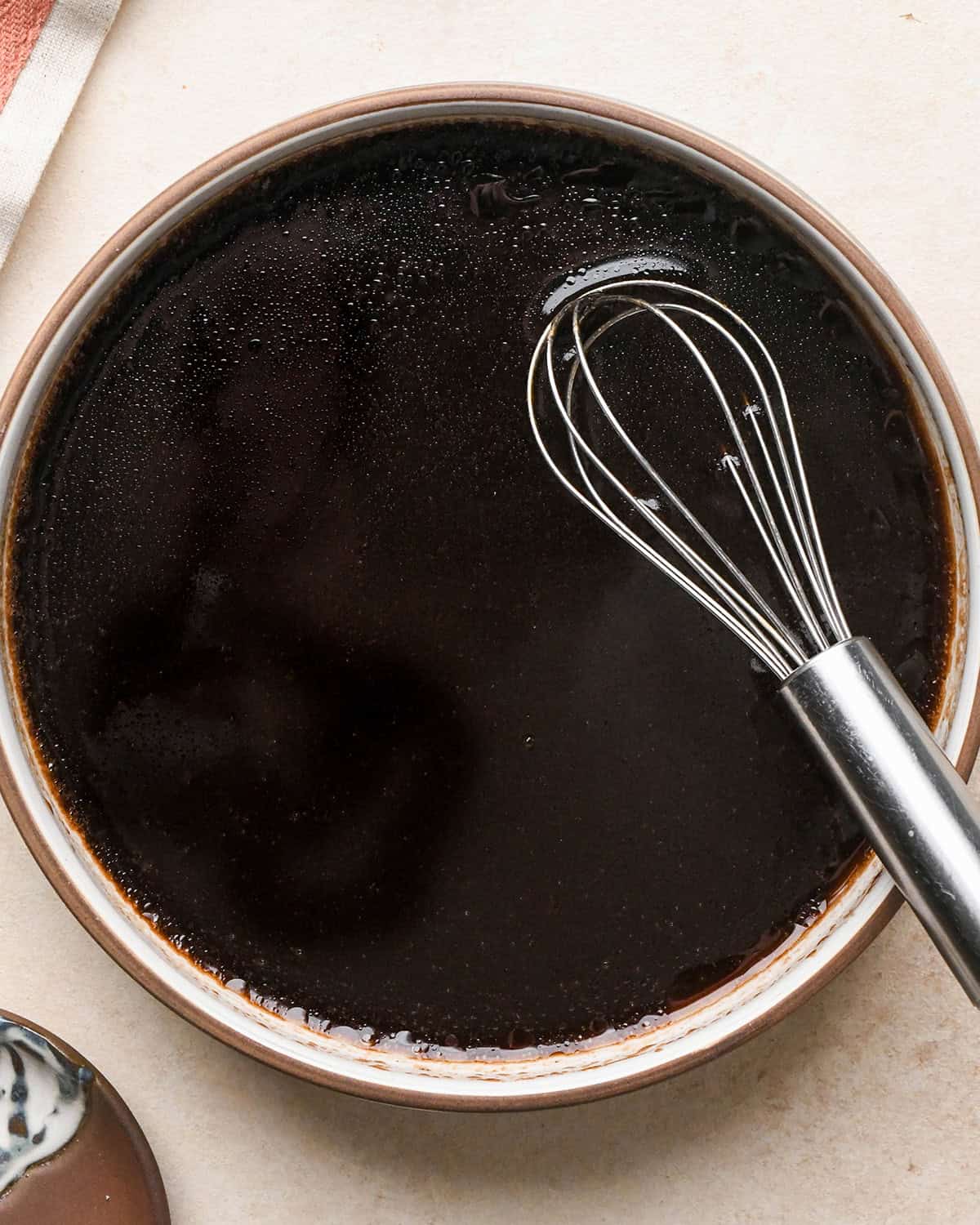 making burrata salad dressing in a small bowl - ingredients after mixing