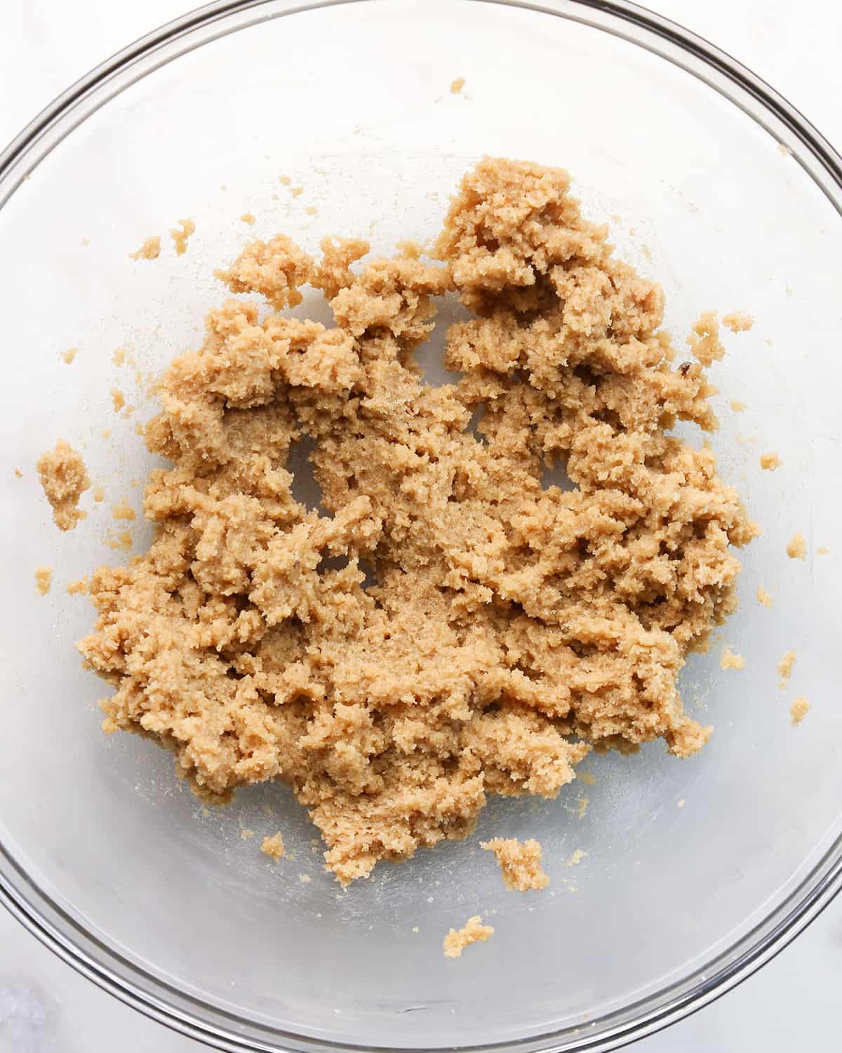 making a Chocolate Chip Skillet Cookie - butter and sugars in a bowl after beating