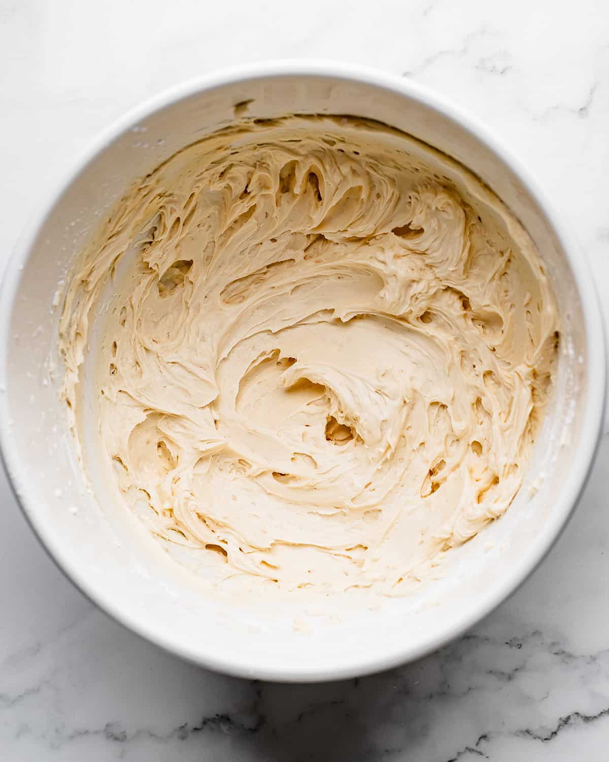 making Coconut Frosting - after mixing in vanilla and powdered sugar
