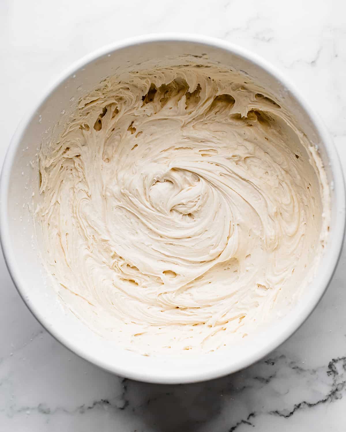 making Coconut Frosting - after beating in coconut milk and additional powdered sugar