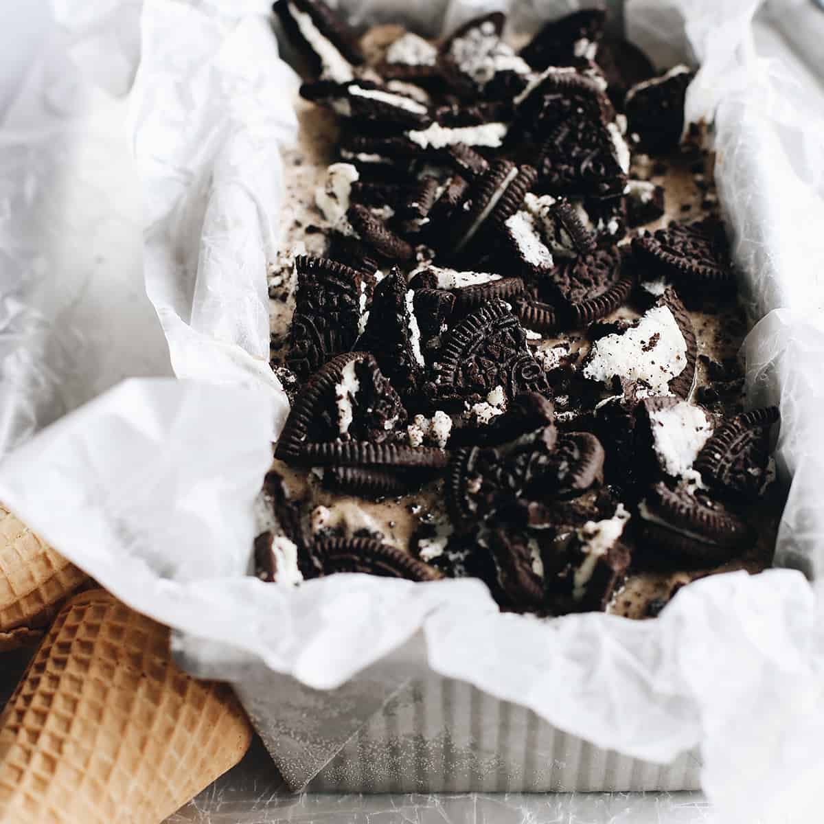 The best cookies and cream ice cream recipe! A creamy Oreo ice cream is loaded with crushed and chopped cookies for a big cookie flavor in every bite! Cookies and Cream Ice Cream (Oreo Ice Cream) in a container