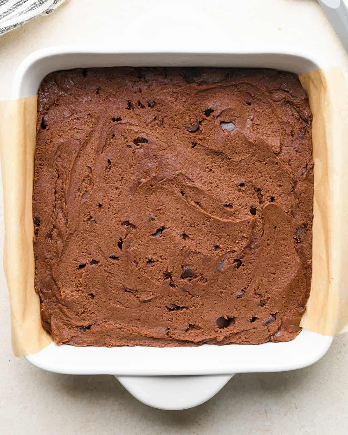 chocolate cookie bars dough spread into an 8x8" baking dish