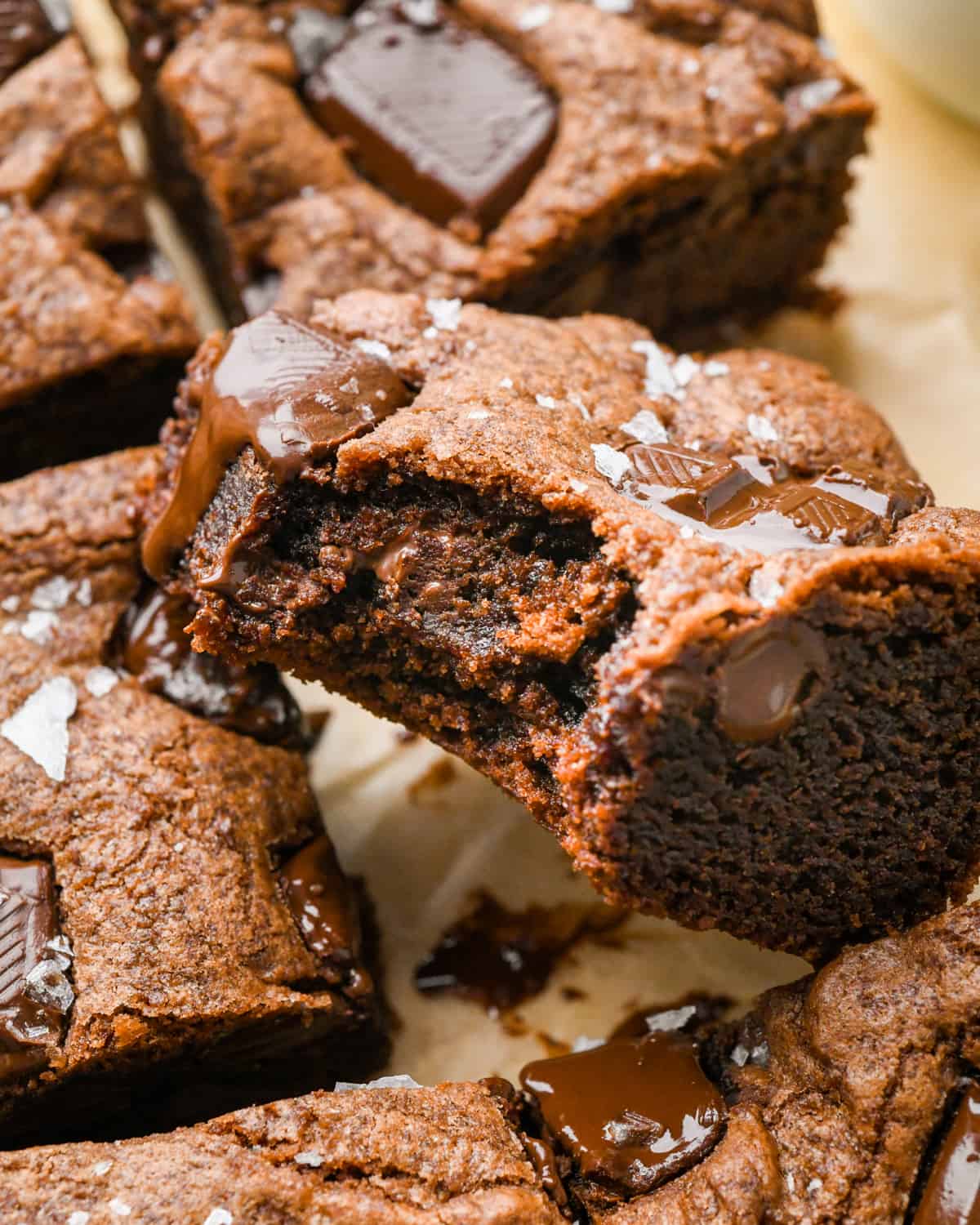4 Double Chocolate Cookie Bars, one with a bite taken out of it so the texture of the inside is visble
