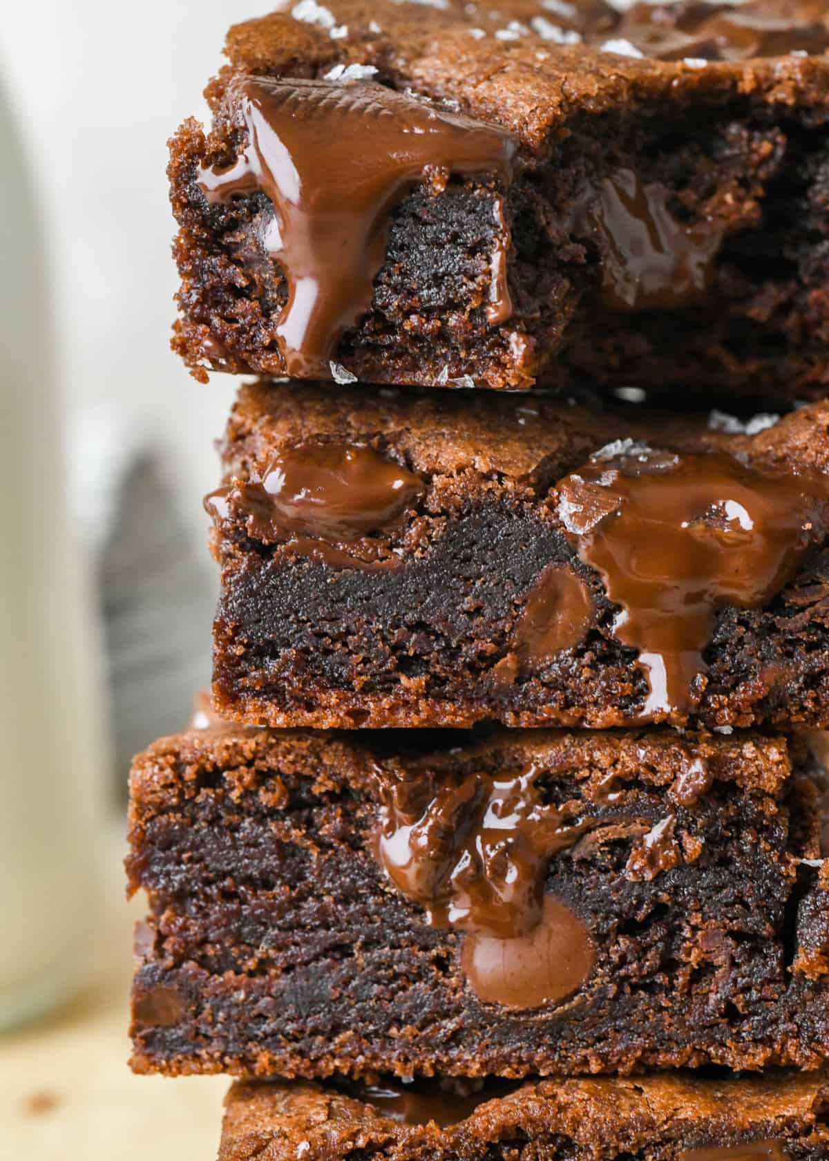a stack of 3 Double Chocolate Cookie Bars, the top one with a bite taken out of it