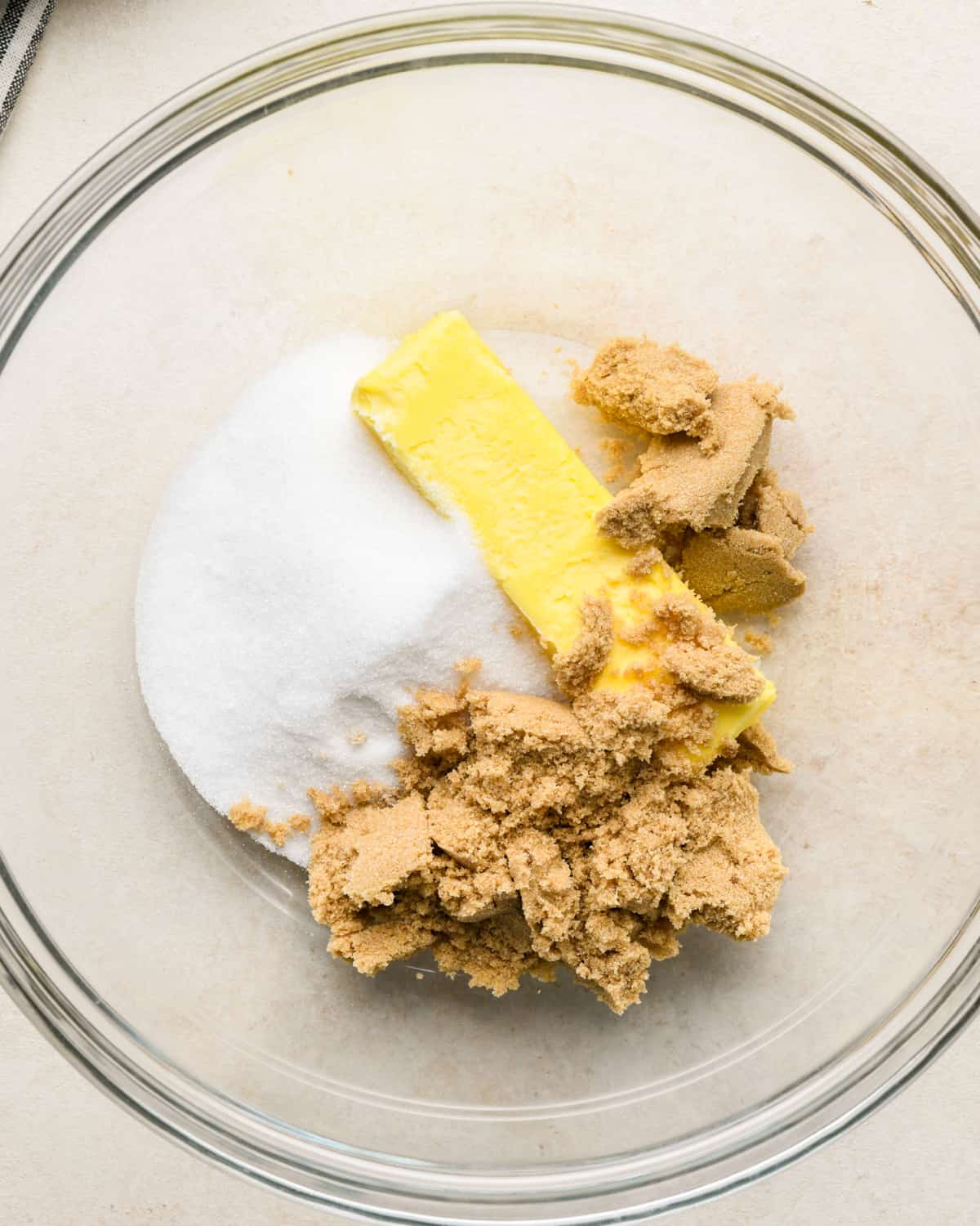 how to make chocolate cookie bars - butter, granulated sugar and brown sugar before mixing