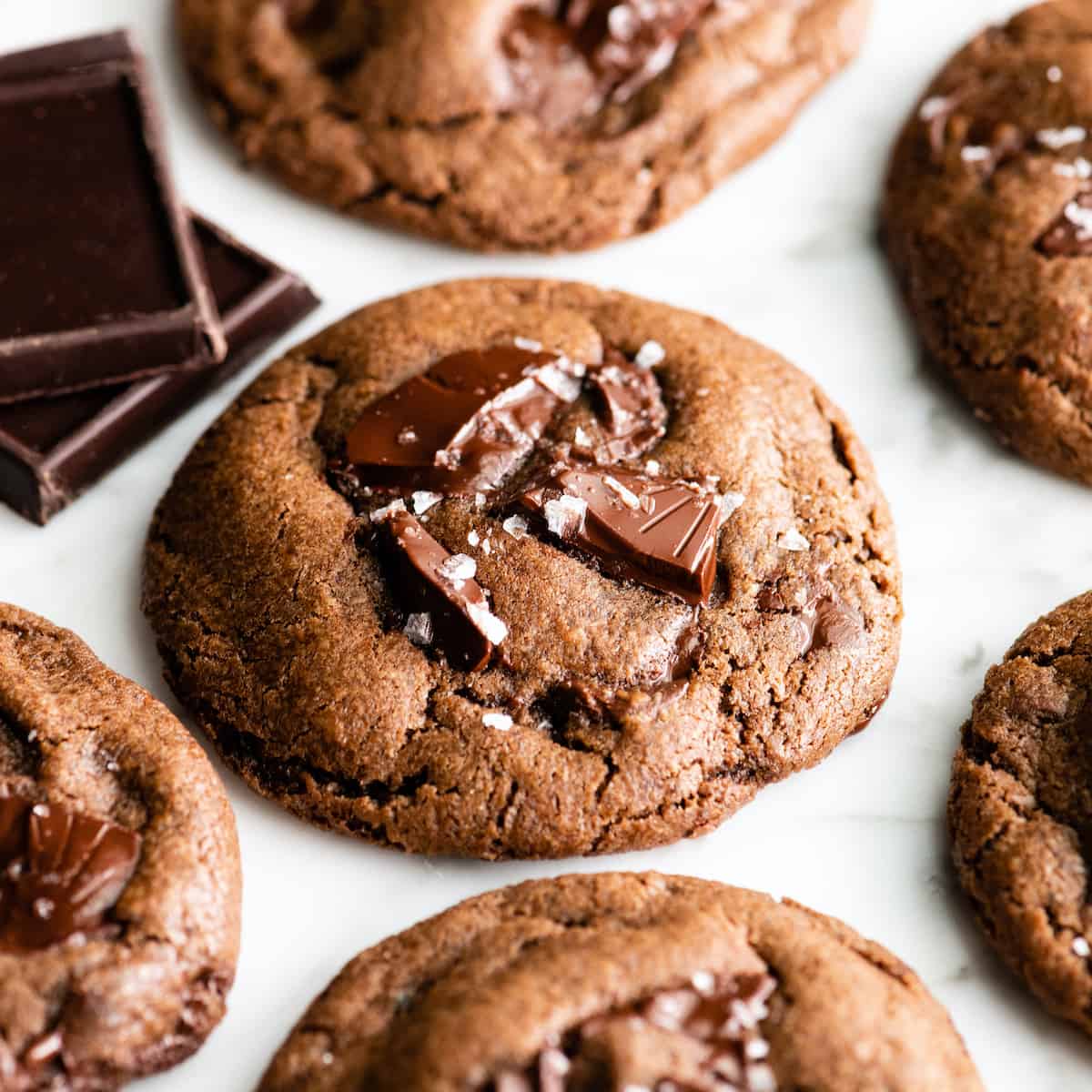 front view of 6 chocolate cookies with sea salt on top