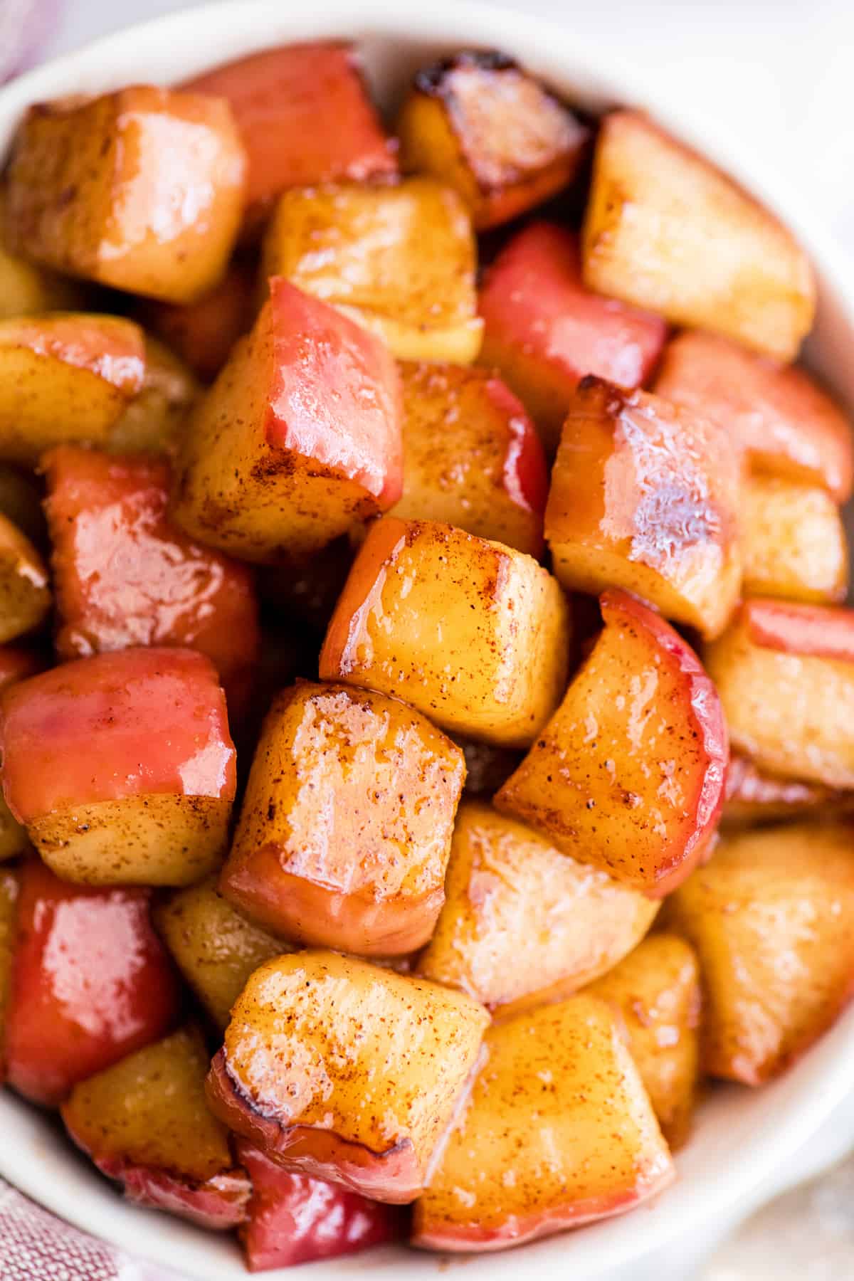 up close overhead view of cinnamon apples in a bowl