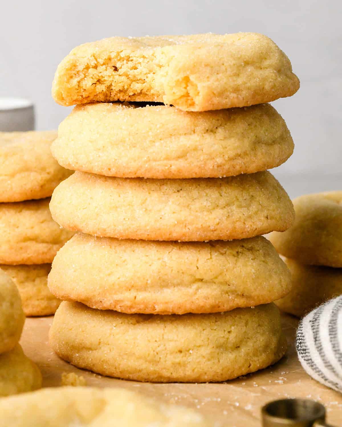 a stack of 5 Easy Sugar Cookies, the top one with a bite taken out of it