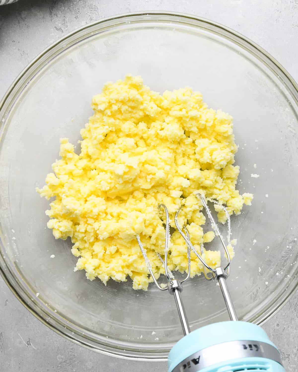 How to Make Easy Sugar Cookies - butter and sugar in a bowl after beating with a hand mixer