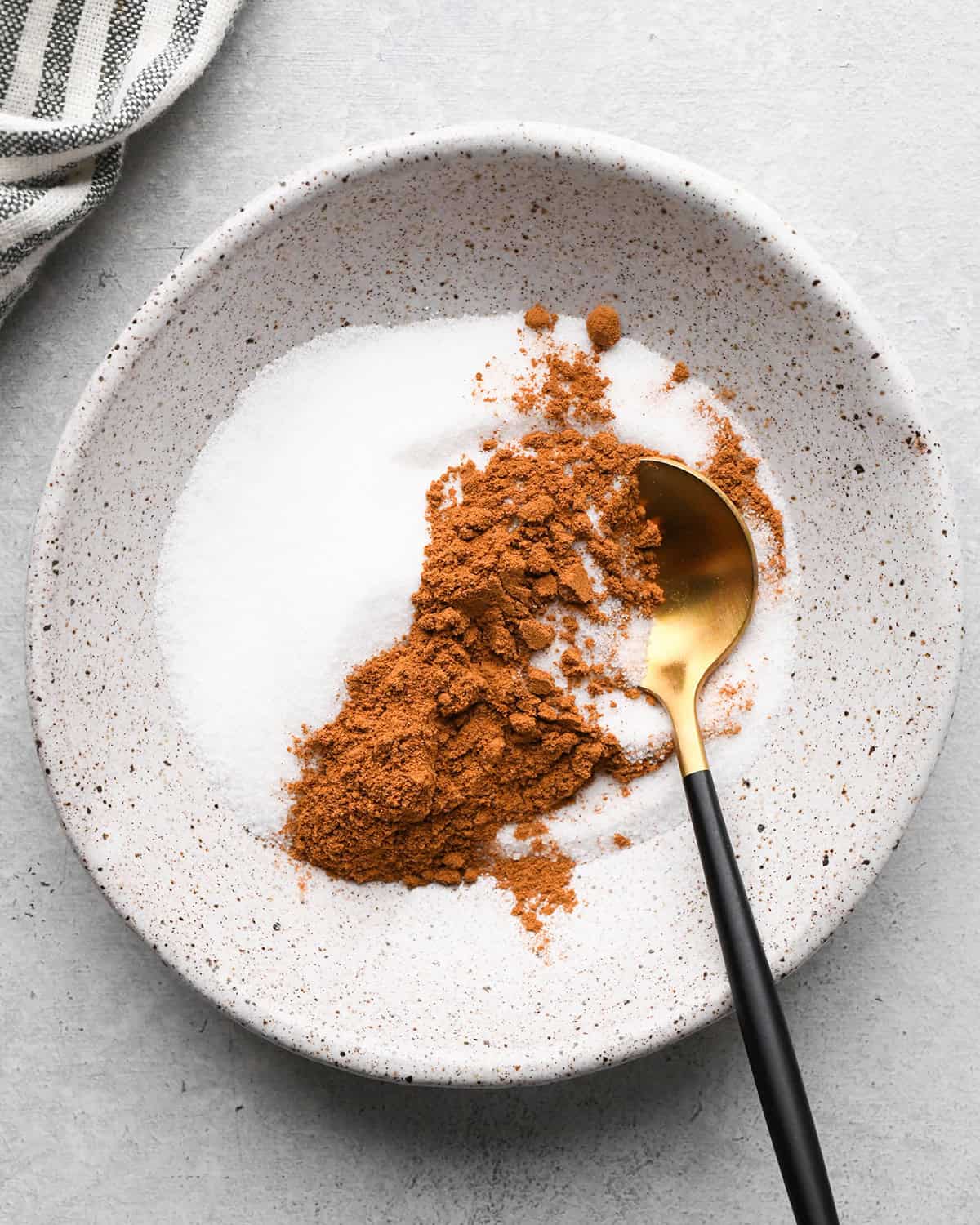 making Fruit Salsa with Cinnamon Chips - sugar and cinnamon in a bowl before mixing