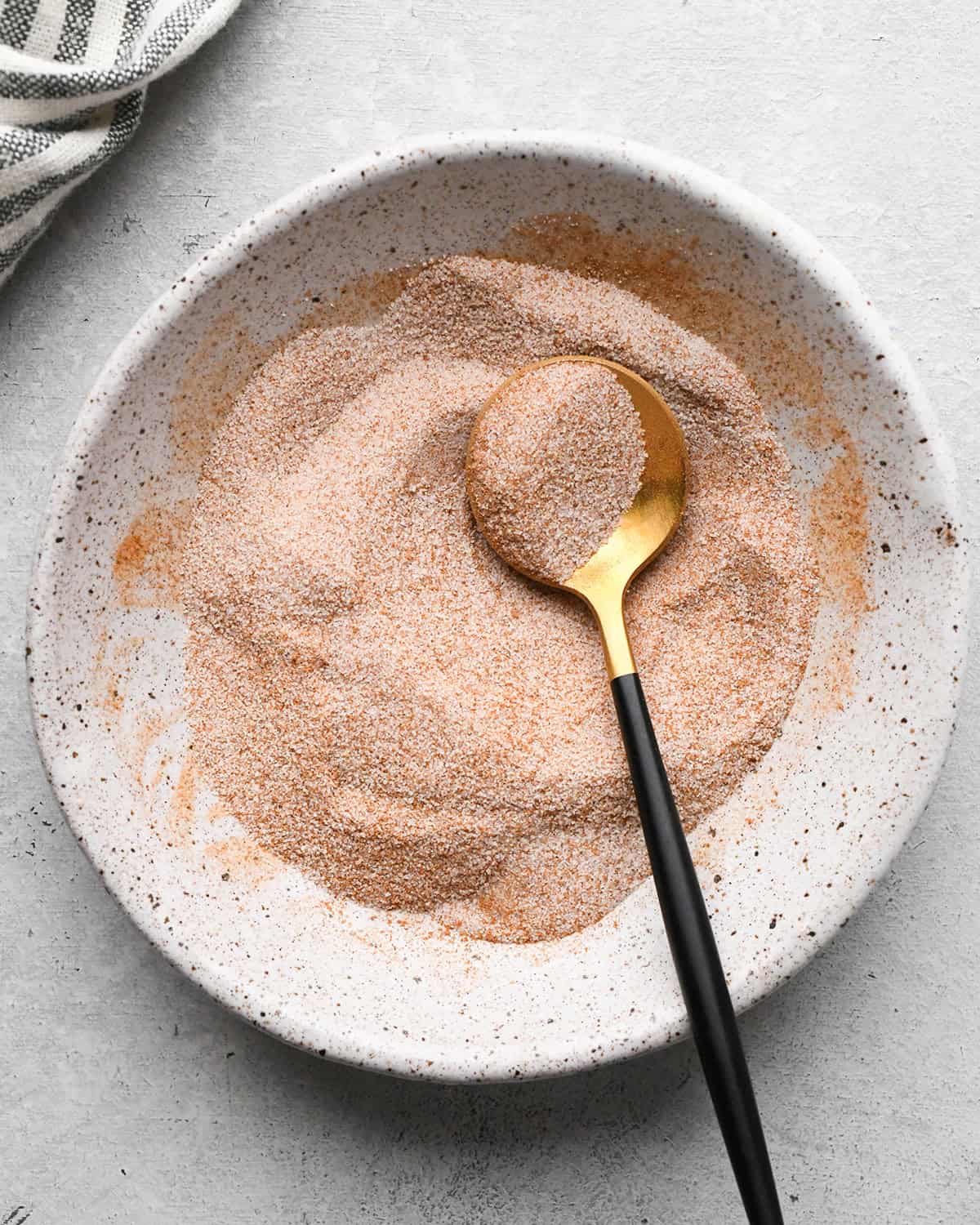 making Fruit Salsa with Cinnamon Chips - after mixing cinnamon and sugar together in a bowl with a spoon