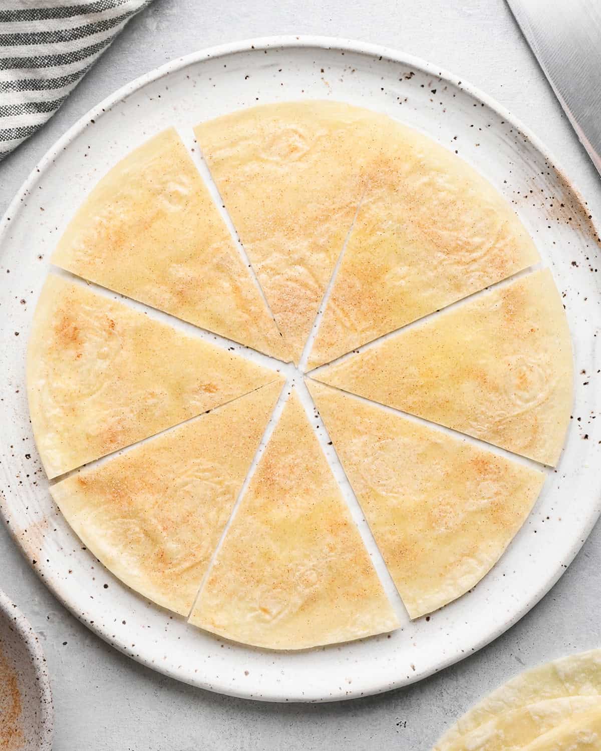 making Fruit Salsa with Cinnamon Chips - a tortilla with cinnamon sugar cut into 8 triangles