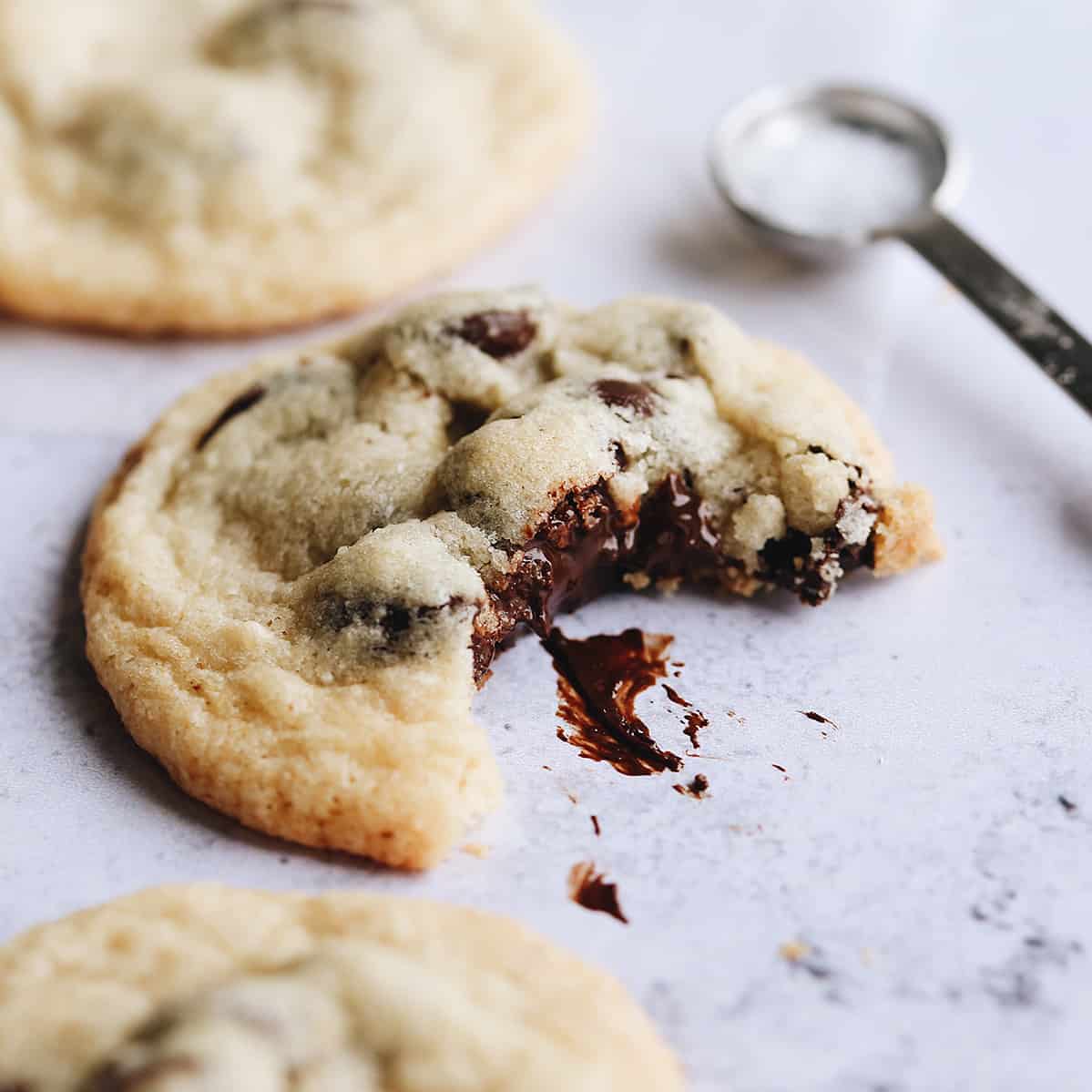 one Gluten Free Chocolate Chip Cookie with a bite taken out of it