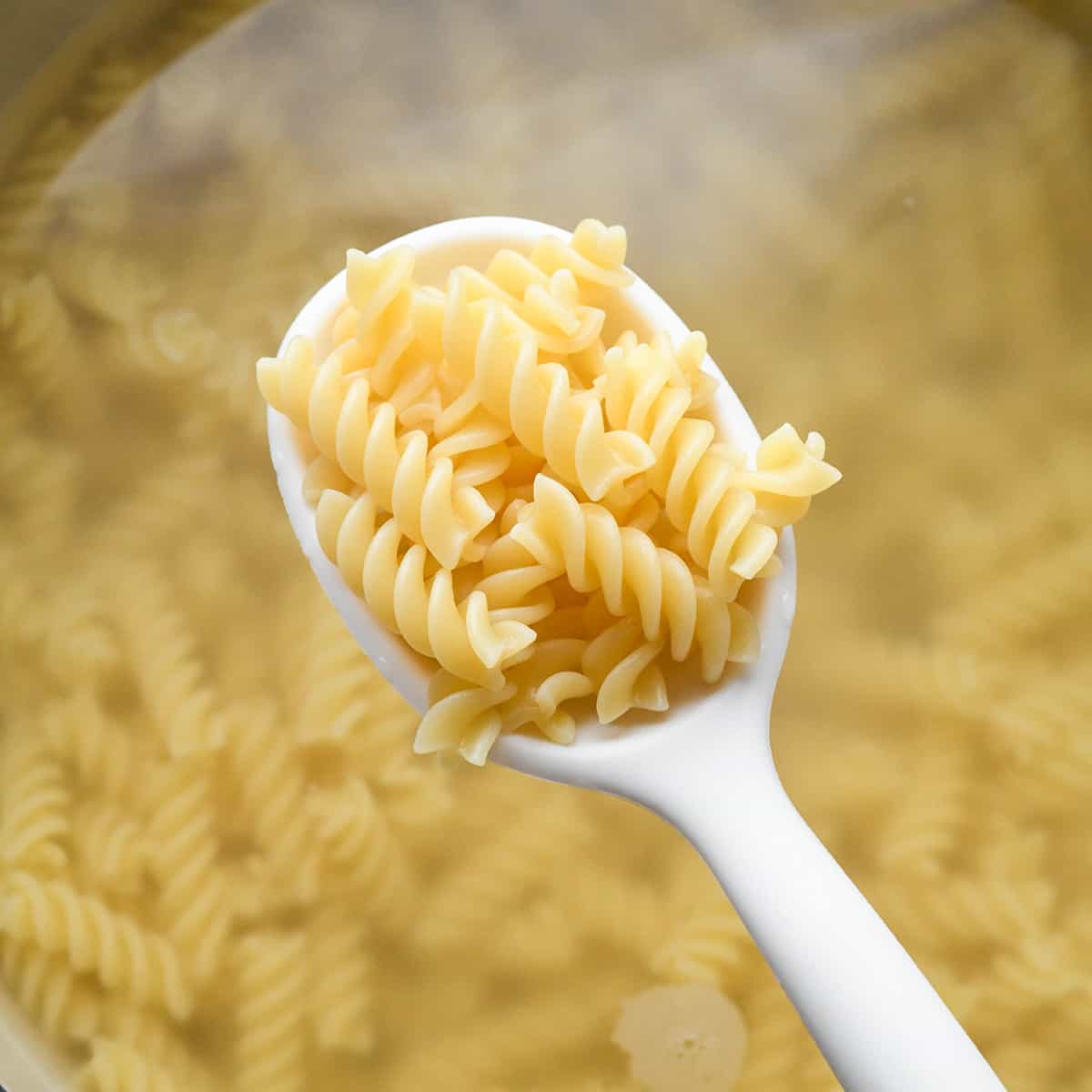 pasta cooking to make Greek Pasta Salad