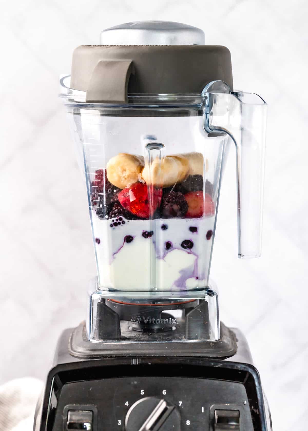 Greek Yogurt Smoothie ingredients in a vitamix blender before blending