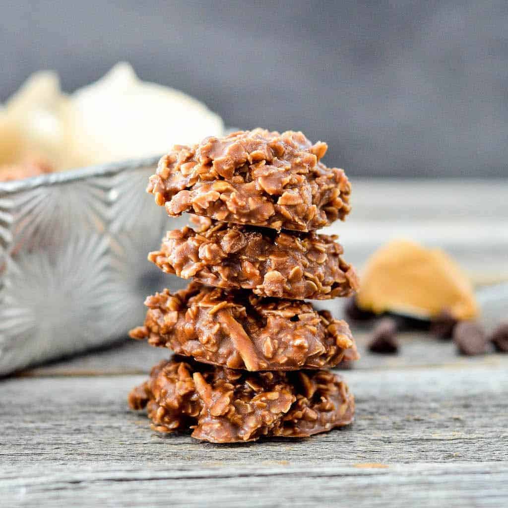 Healthy No-Bake Chocolate Peanut Butter Cookies! With only 8 good-for-you ingredients, they're a delicious treat you can feel great about eating! #glutenfree #dairyfree #vegan #refinedsugarfree #chocolate #peanutbutter #dessert #cookies #nobake #healthyrecipe #healthydessert Front view of a stack of three Healthy No-Bake Chocolate Peanut Butter Cookies