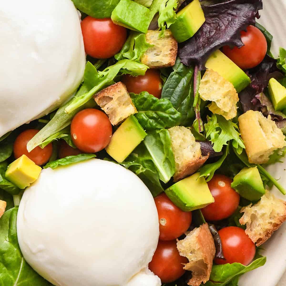 This Easy Homemade Croutons Recipe is made with 4 ingredients in 15 minutes! Learn how to make garlic croutons by following my step-by-step tutorial and video! They will transform any salad from good to WOW! #croutons #croutonrecipe #homemadecroutons #salad Homemade Croutons on a salad