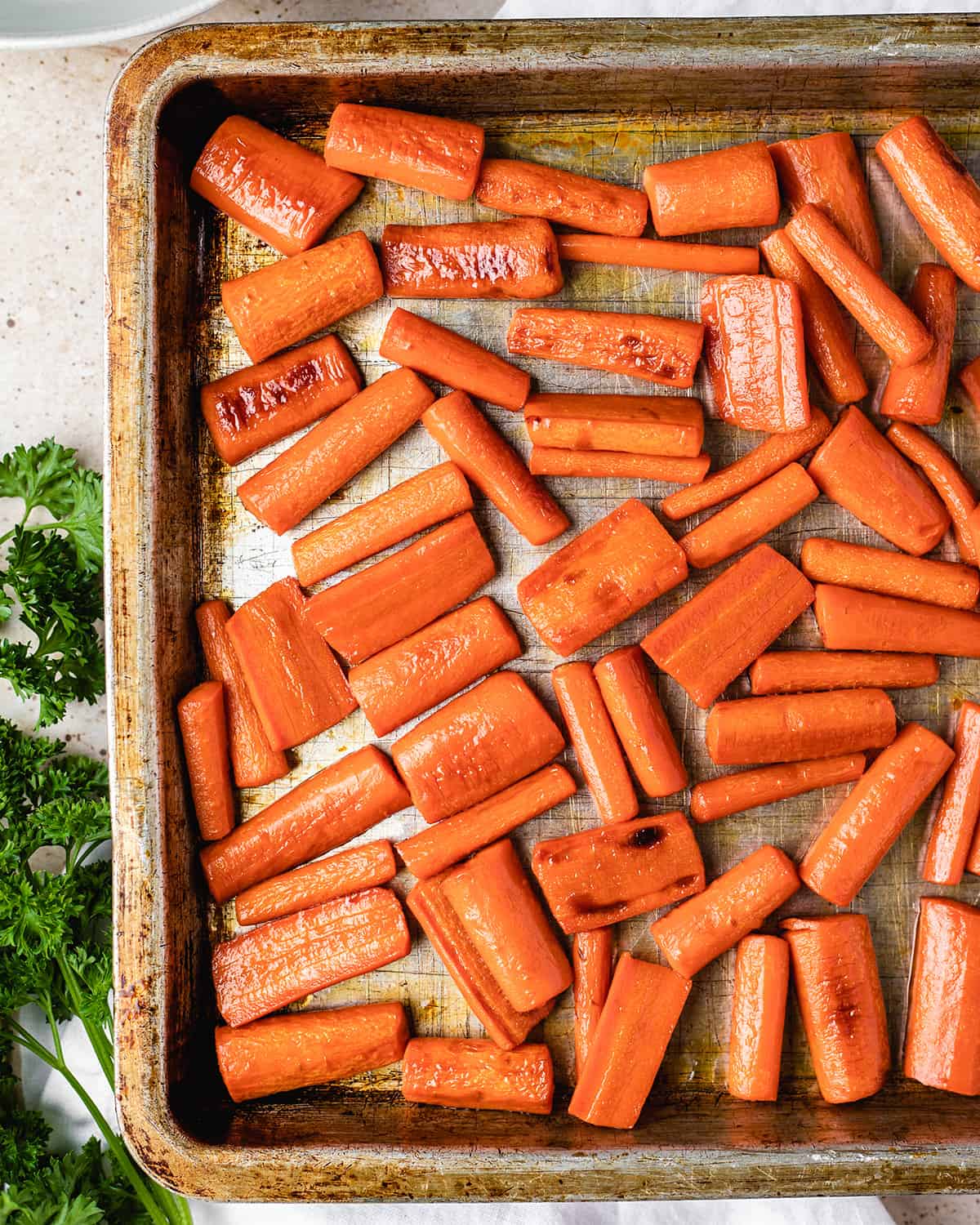 honey glazed carrots on a baking sheet