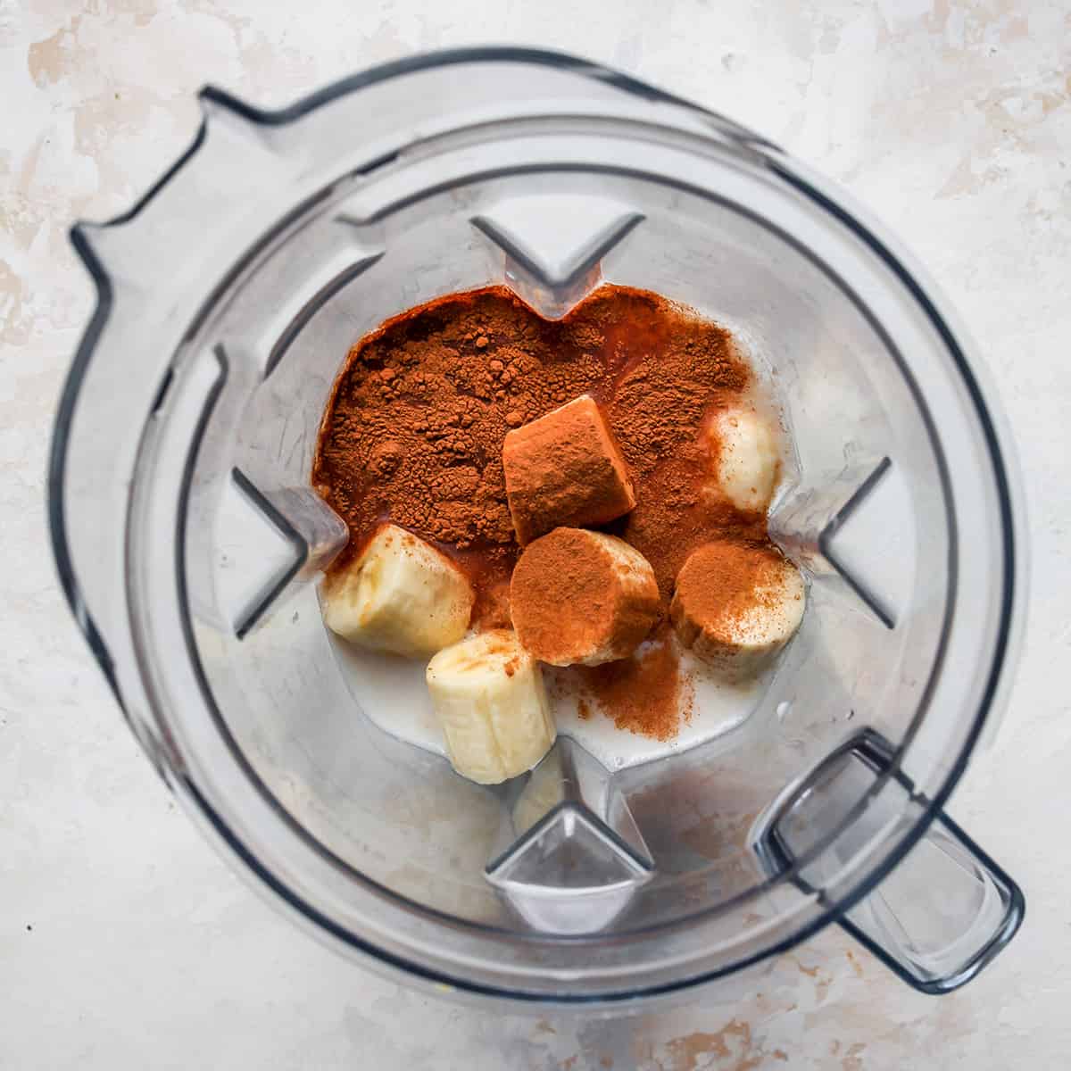 photo showing How to Make a Peanut Butter Smoothie - ingredients in the blender before blending