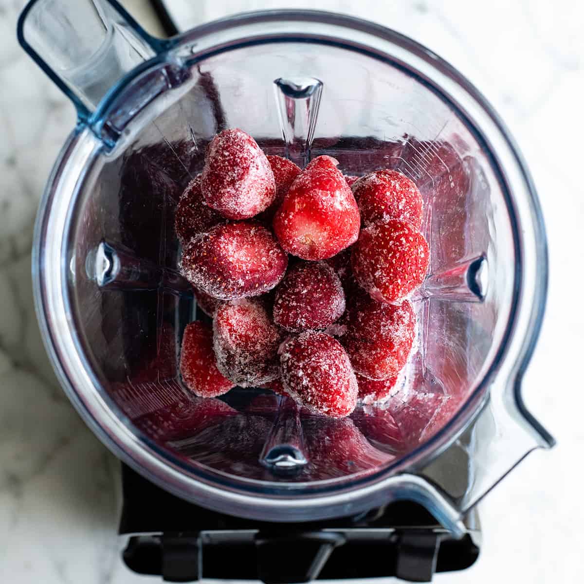 Follow our step-by-step photos & video to learn how to make the BEST easy & healthy smoothie bowl recipe (3 varieties) with 5 ingredients in 5 minutes! Smoothie bowls make the best breakfast, brunch or snack, and you can save so much money making them at home! Paleo, dairy-free and vegan-friendly. overhead photo showing how to make a smoothie bowl