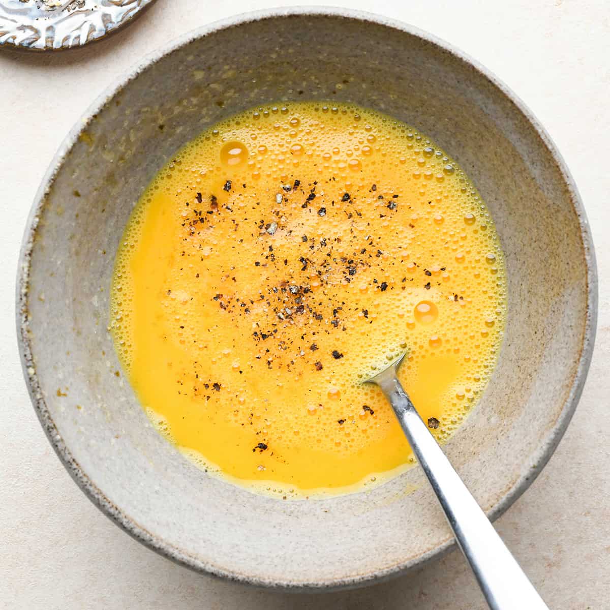 How to Make An Omelet - adding salt and pepper