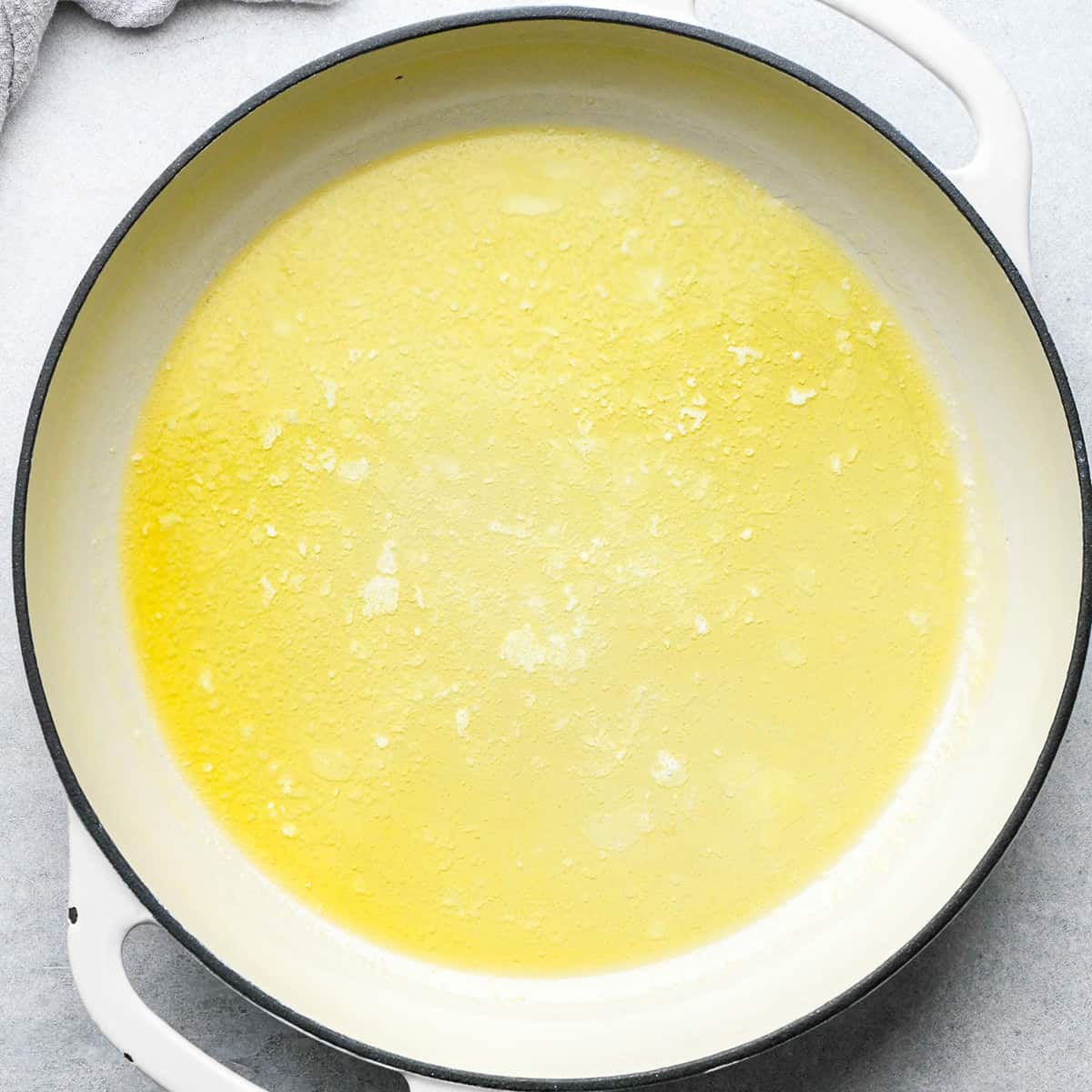 butter melted in a saucepan to make potatoes au gratin