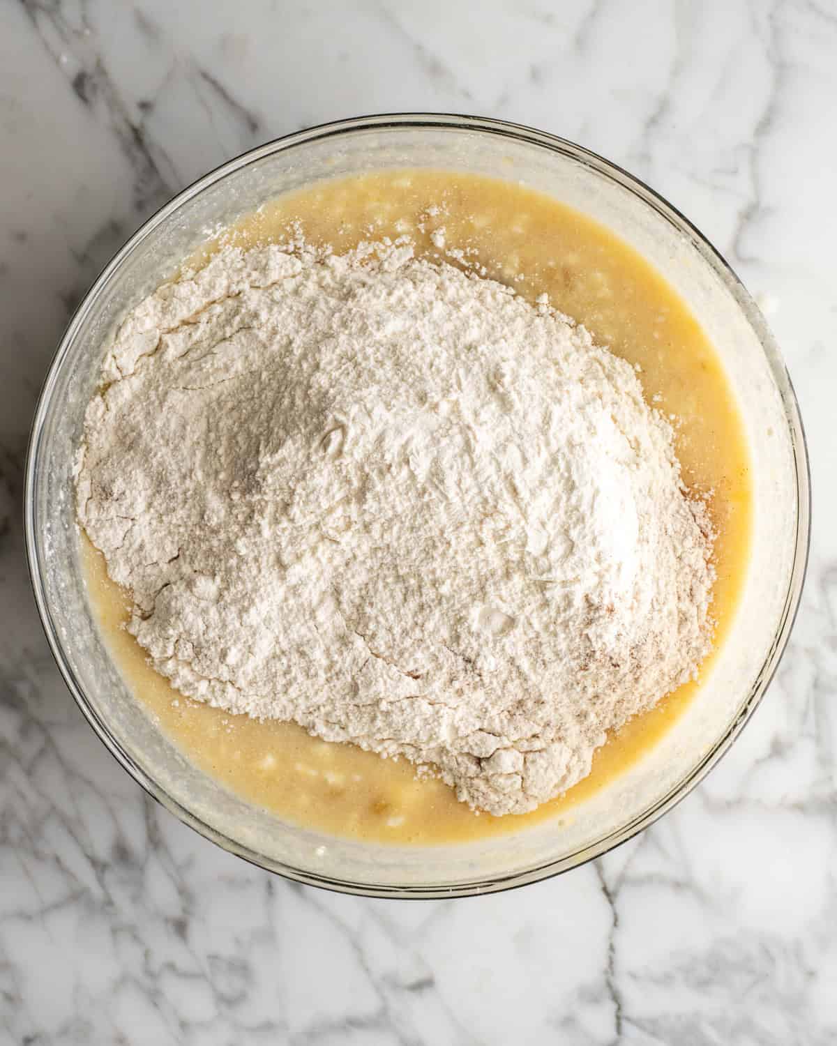 How to Make Banana Cake - dry ingredients added to wet mixture before stirring