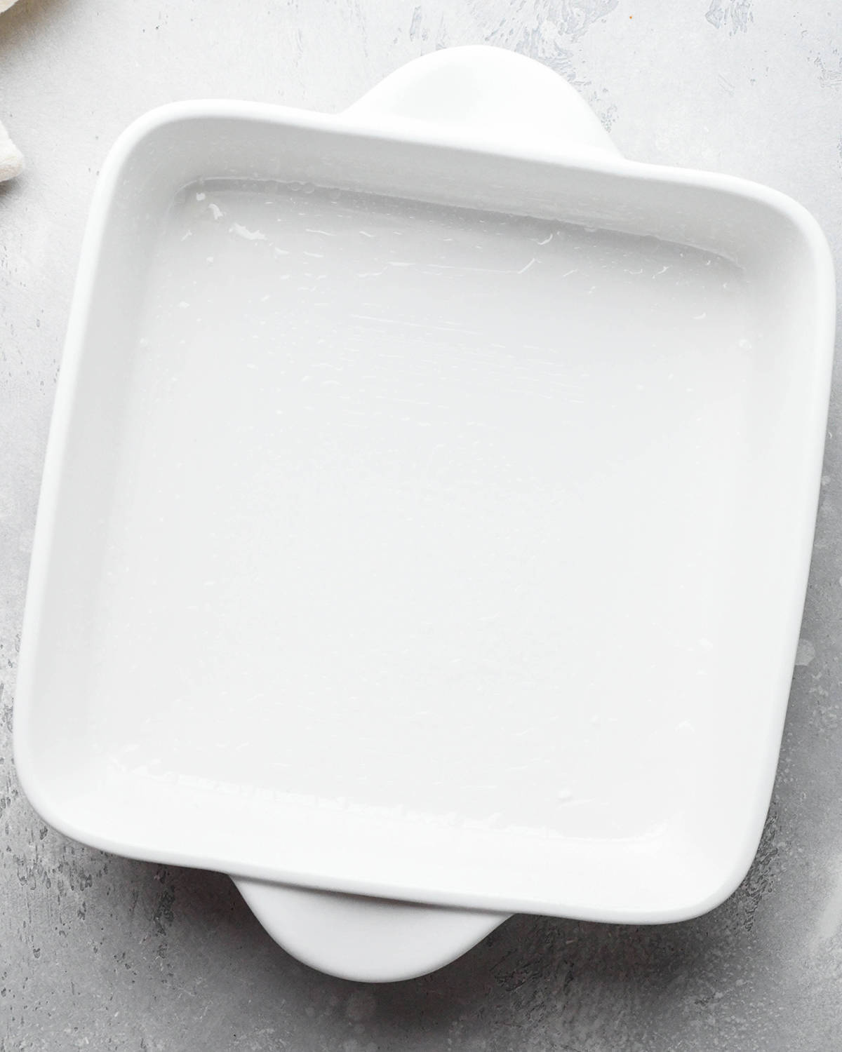 a greased, white 8x8" pan