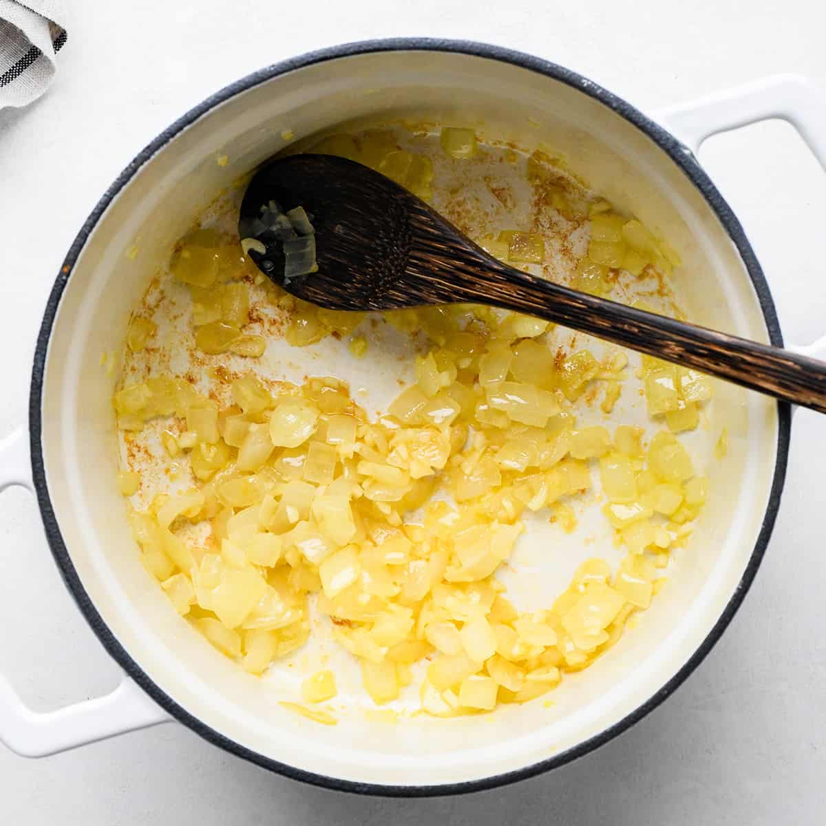 photo showing how to make black bean dip - cooking onions and garlic in olive oil