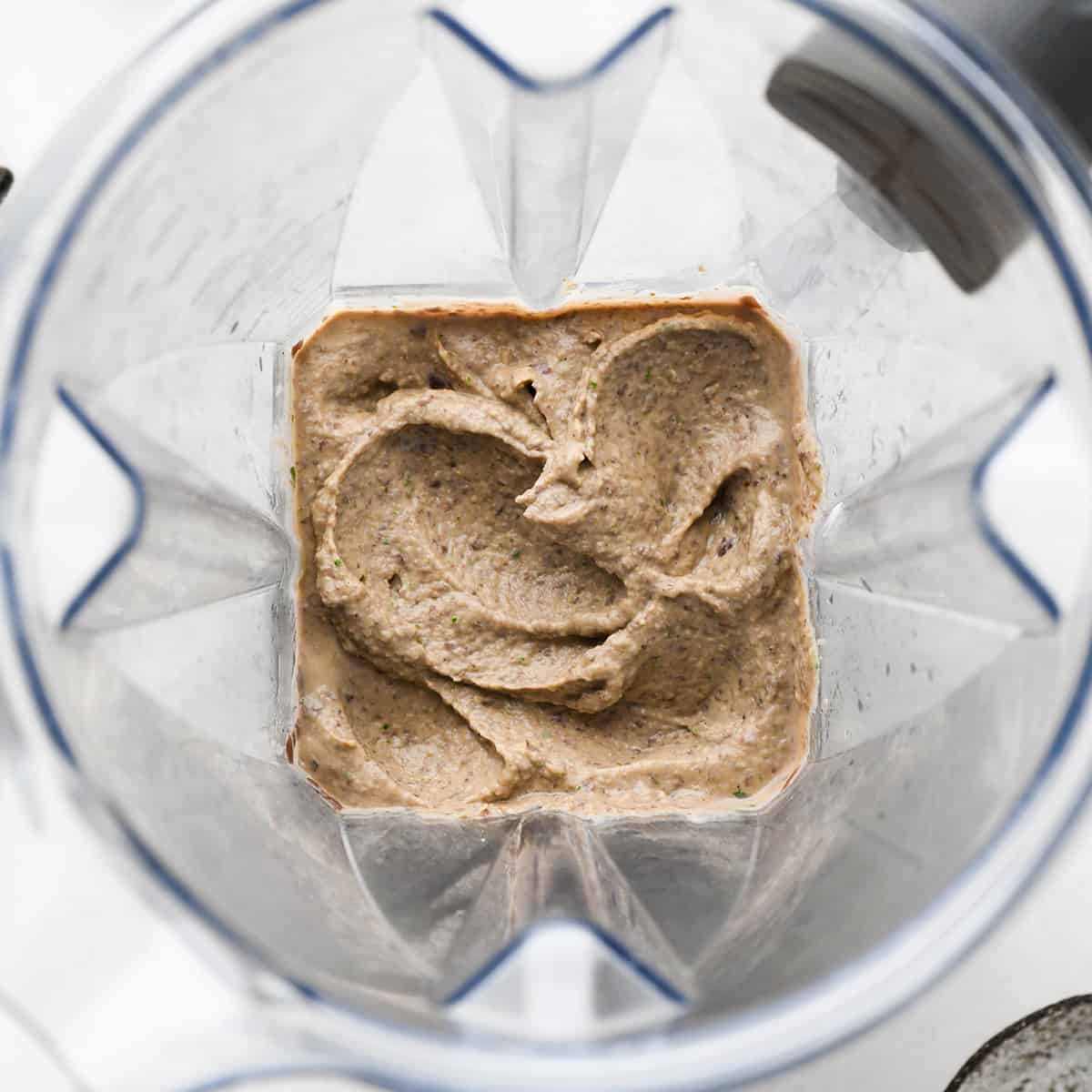 photo showing how to make black bean dip - ingredients in a Vitamix blender after blending