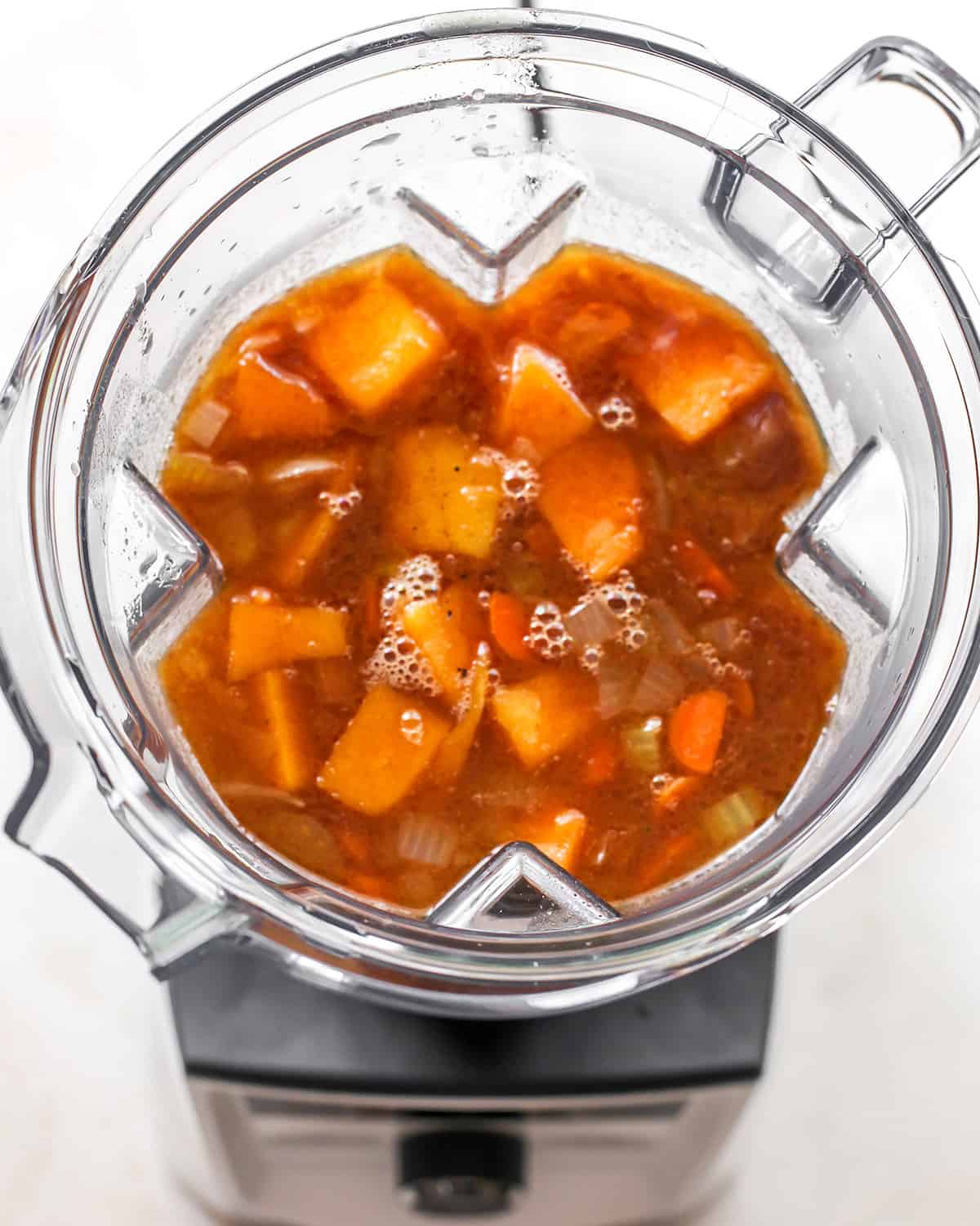 How to Make Butternut Squash Soup - ingredients in a blender before blending