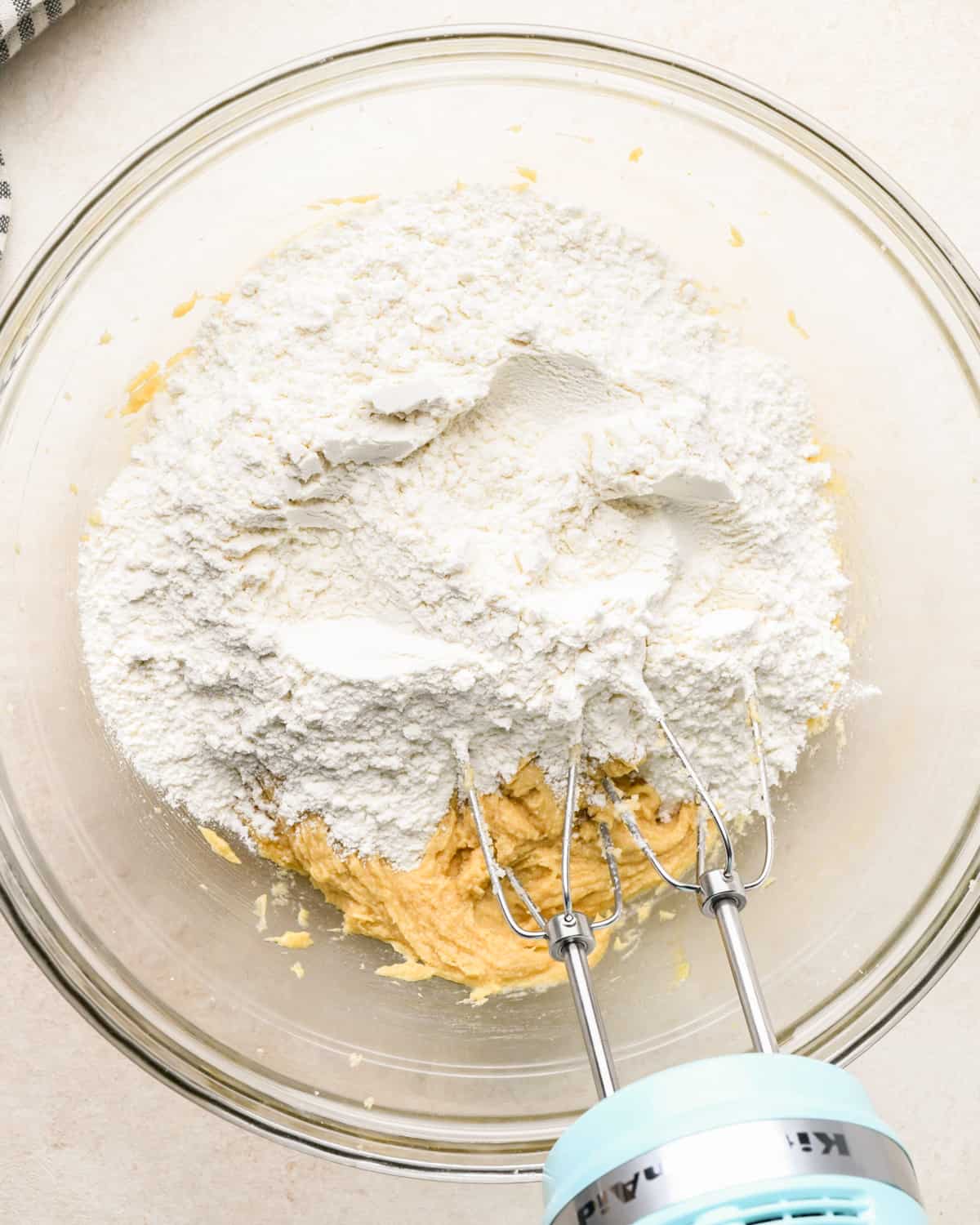 making Caramel Cookie Bars - dry ingredients added before mixing