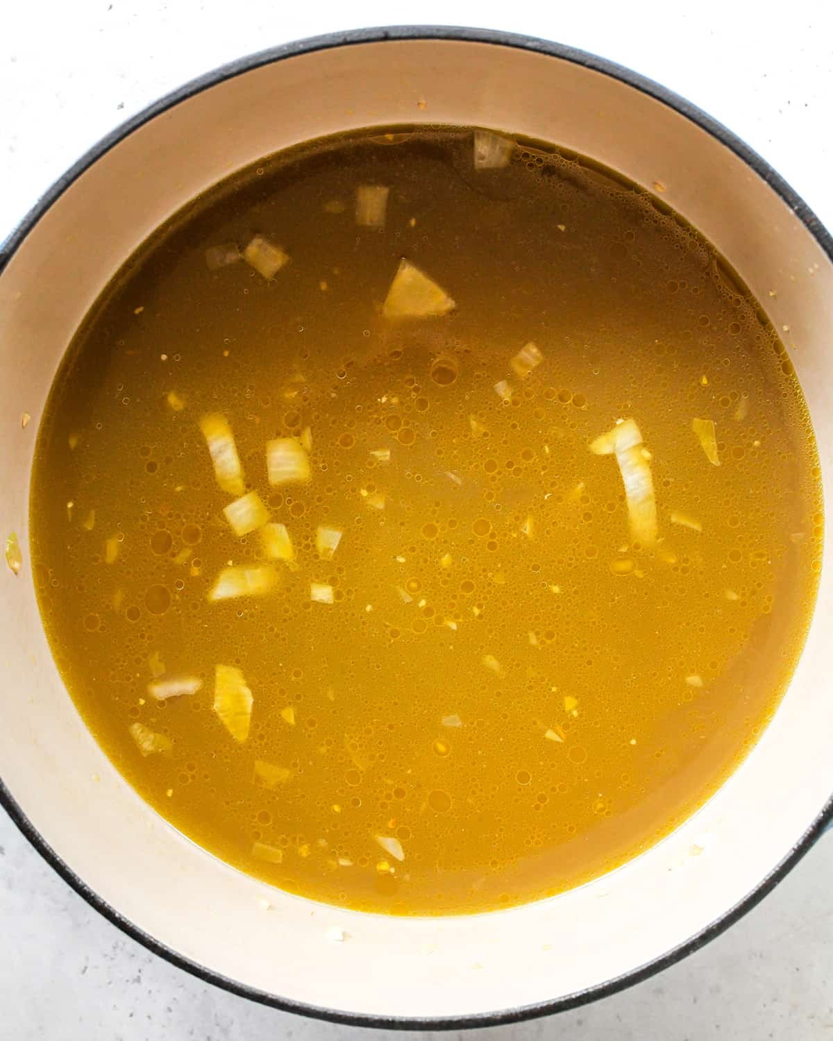 making Chicken Rice Soup - adding broth and boullion