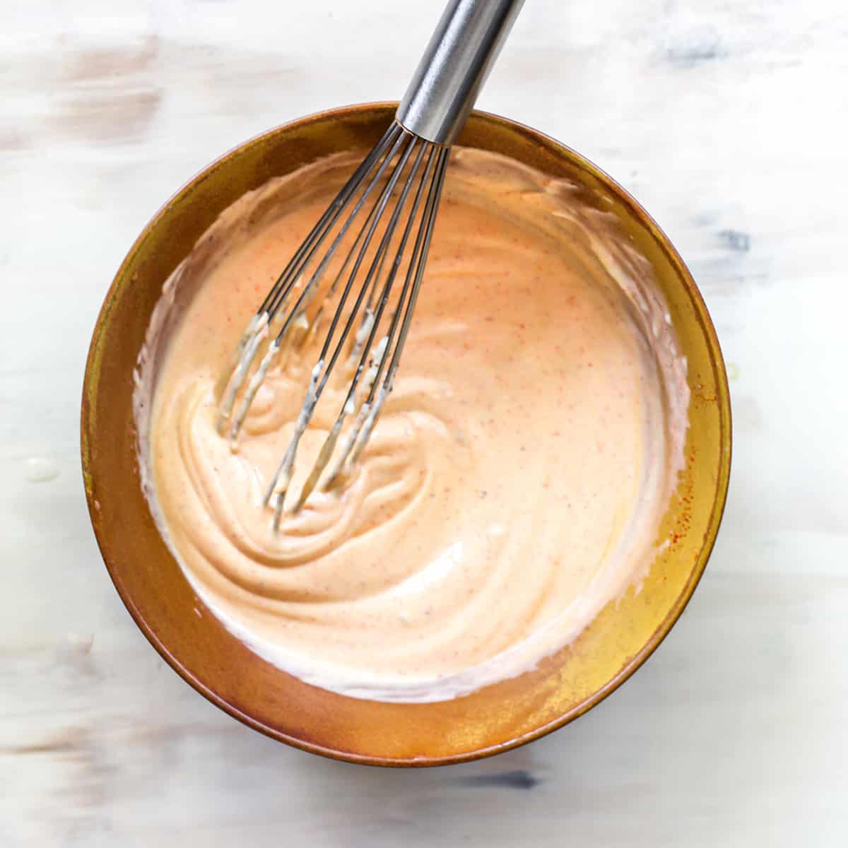 This Chicken Salad Recipe is easy to make with only a handful of simple ingredients. Serve as chicken salad sandwiches or on top of a bed of greens for a delicious, flavorful and light summertime meal! Watch the video and follow our step-by-step instructions to learn how to make chicken salad at home! overhead photo showing how to make chicken salad