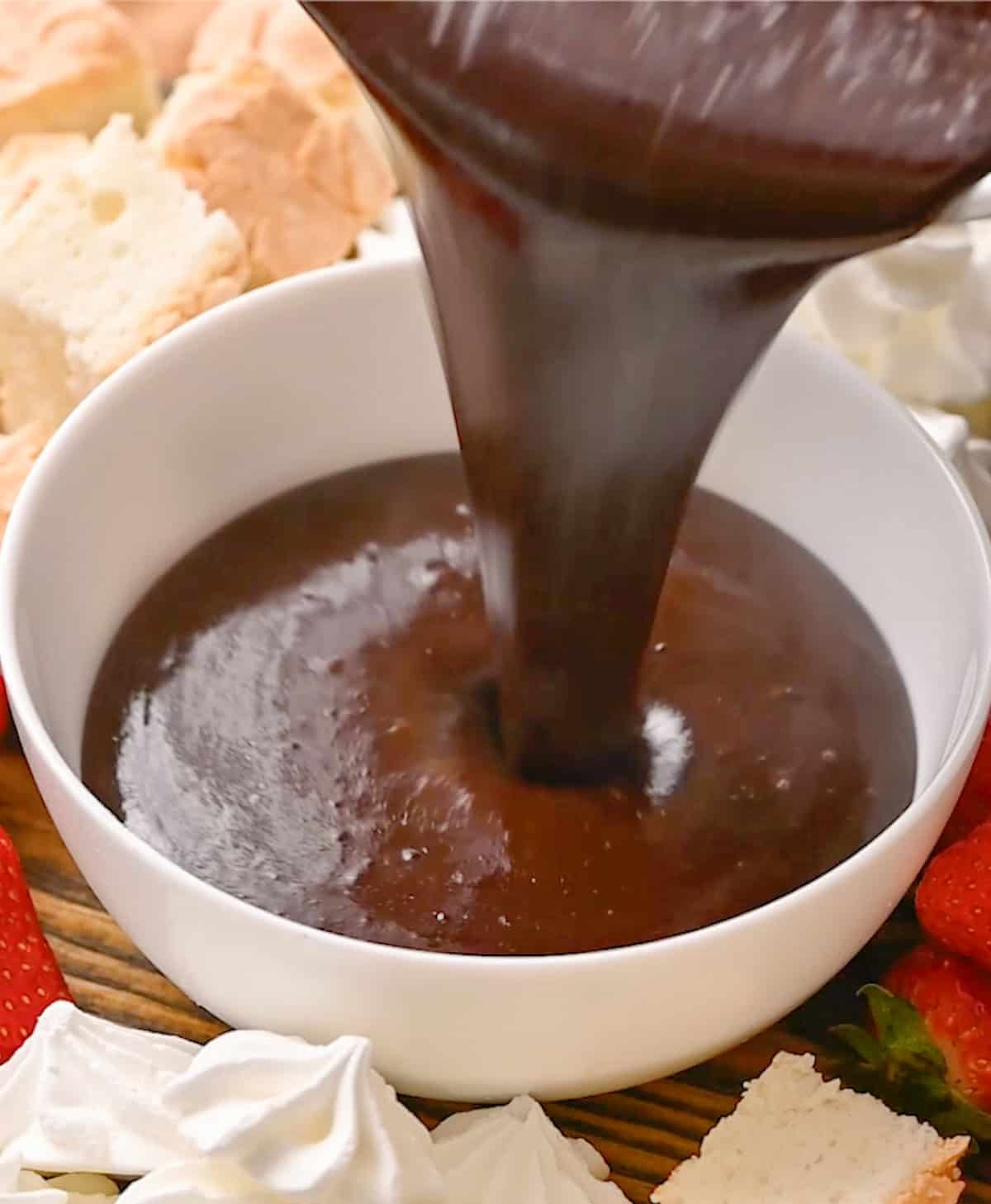 Chocolate Peanut Butter Fondue being poured into a serving dish