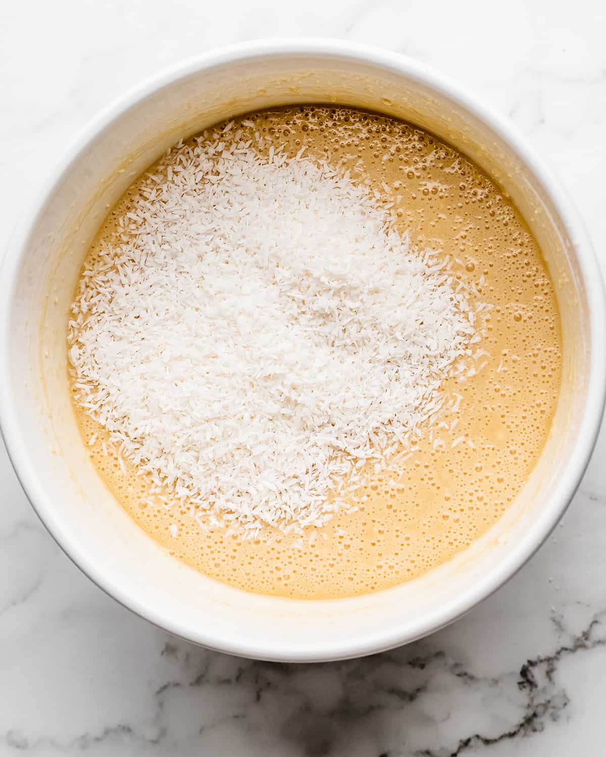 how to make coconut cake- adding coconut before mixing