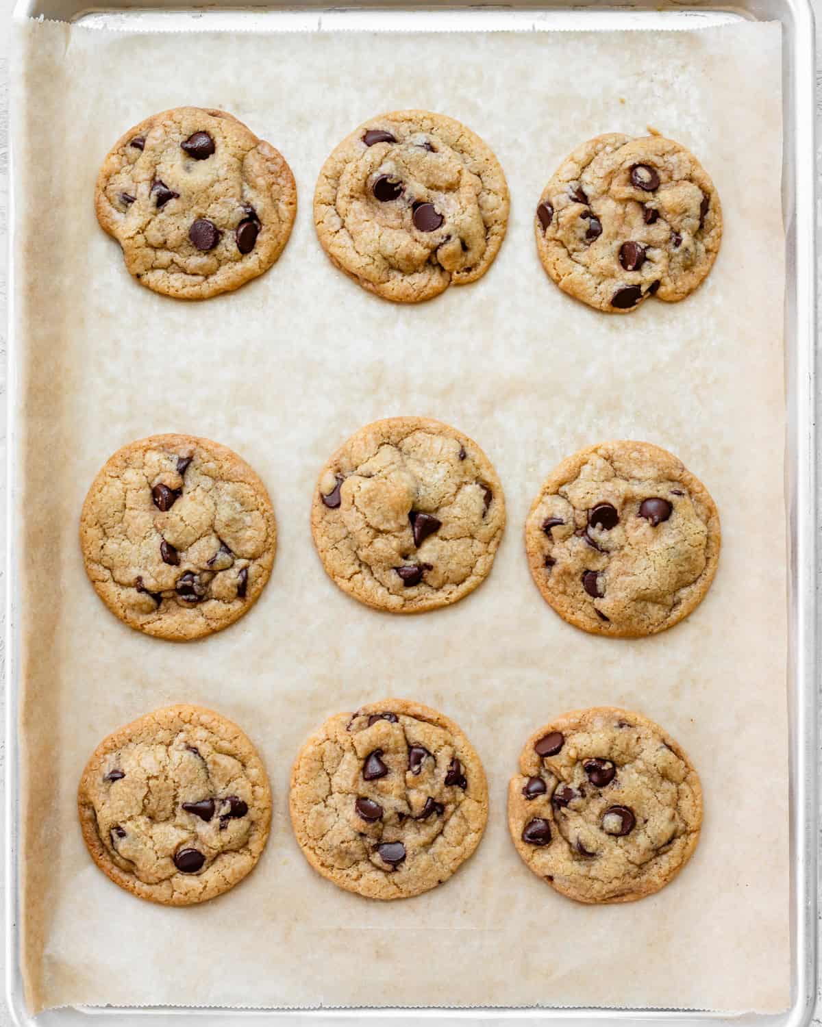 9 Dairy Free Chocolate Chip Cookies on a baking sheet after baking