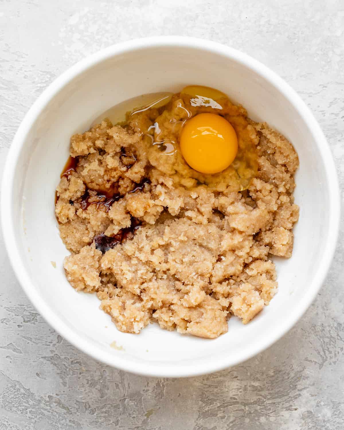 making Dairy Free Chocolate Chip Cookies - vanilla and egg added before beating