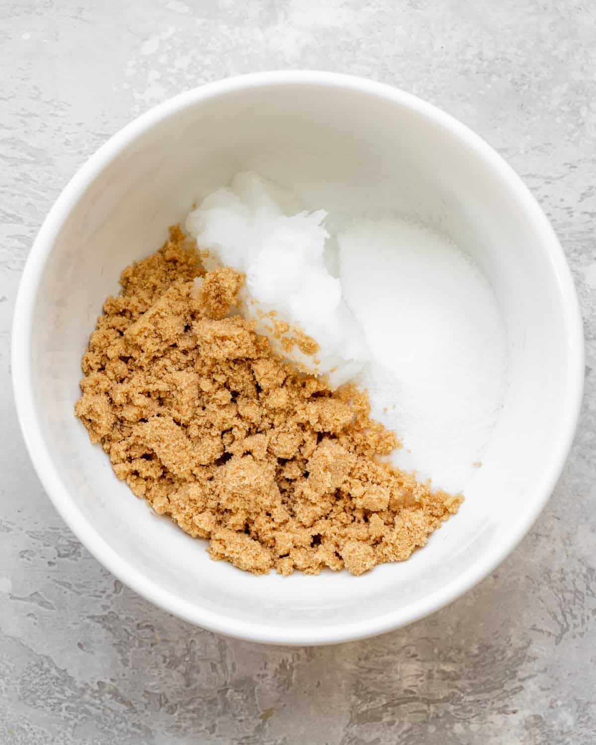 making Dairy Free Chocolate Chip Cookies - coconut oil and sugars in a bowl before beating