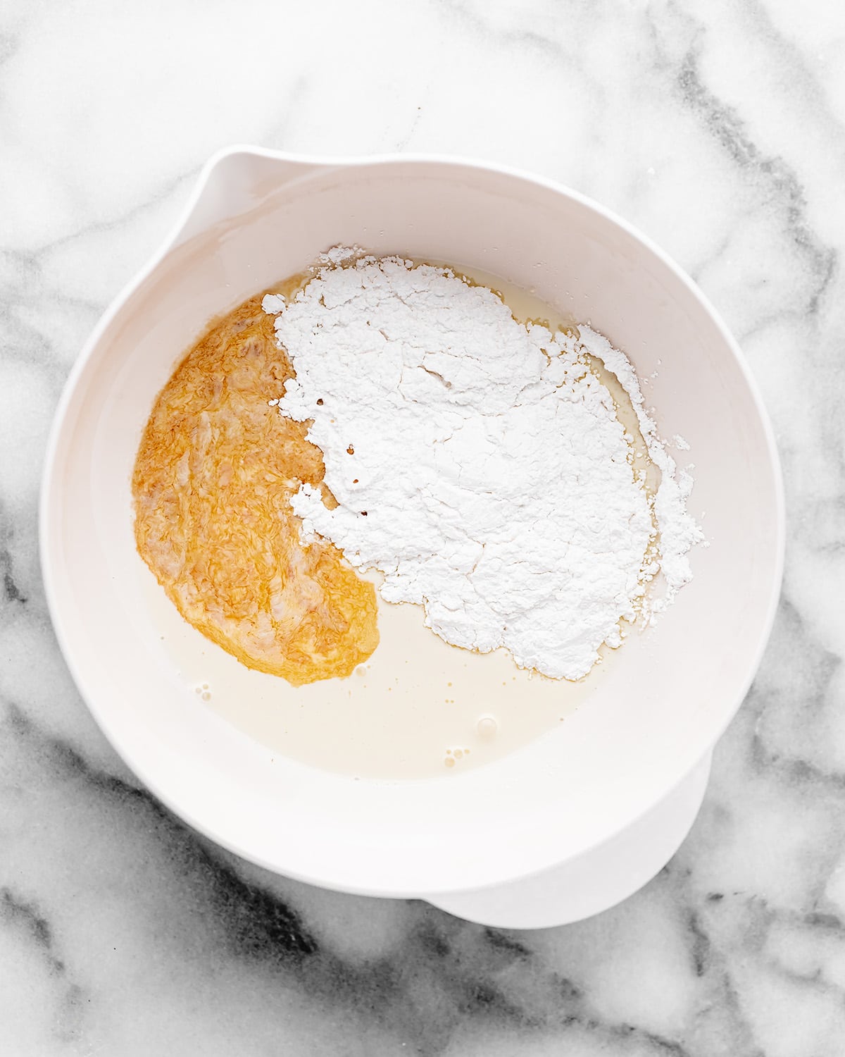 whipped topping ingredients in a bowl before whipping