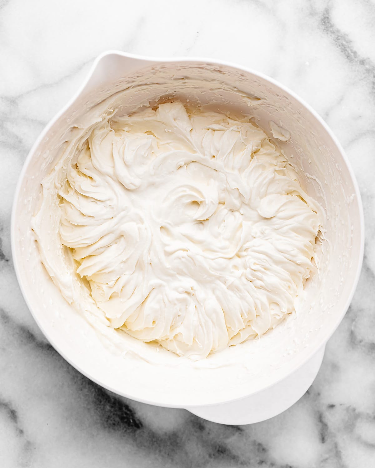 whipped topping ingredients in a bowl after whipping